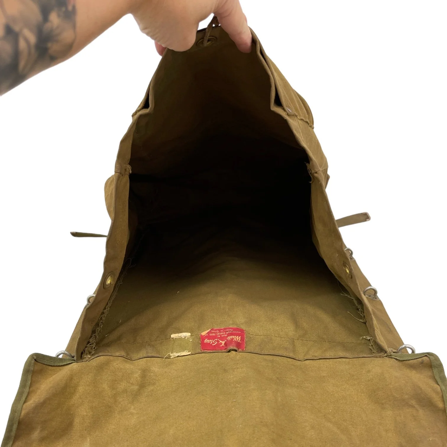 Interior view of a vintage White Stag trapper's style Army green backpack with wooden frame made by Hirsch Weis Canvas Prod. Co., Portland, Oregon. Made in USA