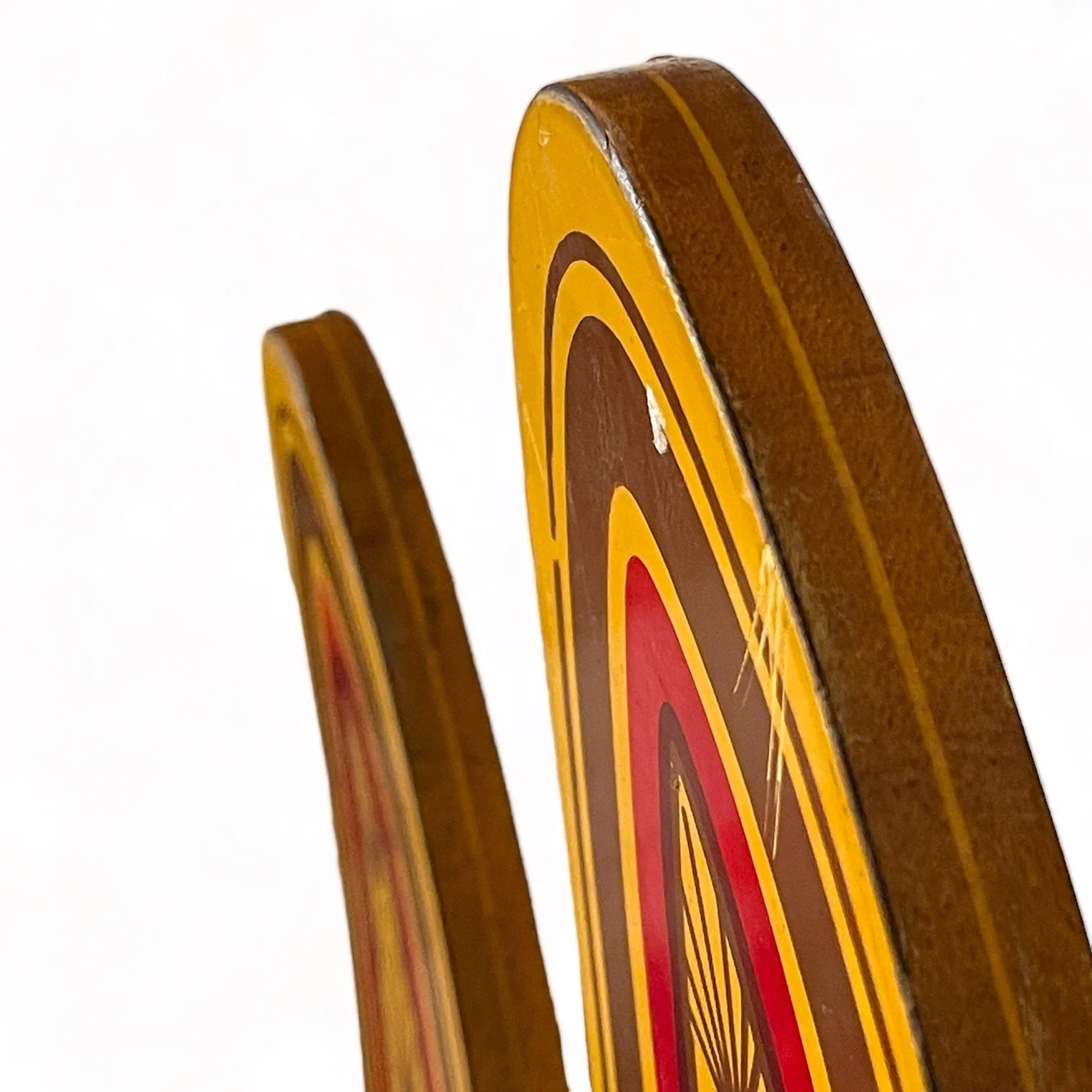 vintage pair of Dekko wooden water skis by Lake Region with an Art Deco pattern in yellow and red.