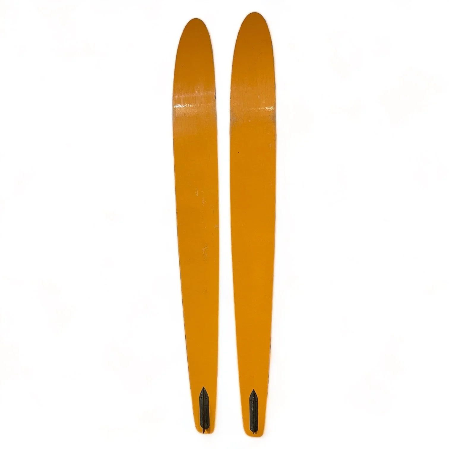 Backside view of a vintage pair of Dekko wooden water skis by Lake Region with an Art Deco pattern in yellow and red.