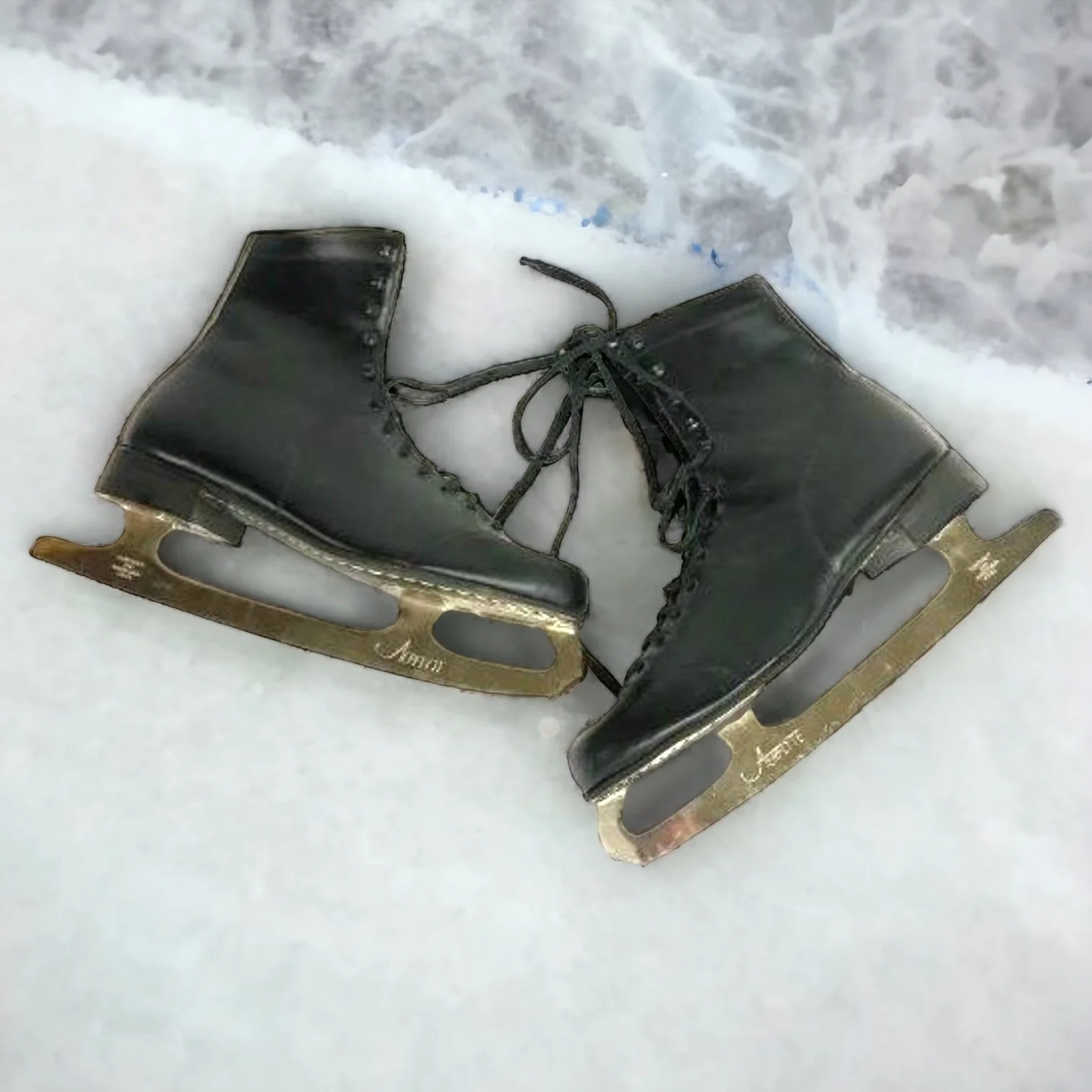 Side view of a pair of Vintage Black Leather Ice Skates by Aerflyte with silver metal blades