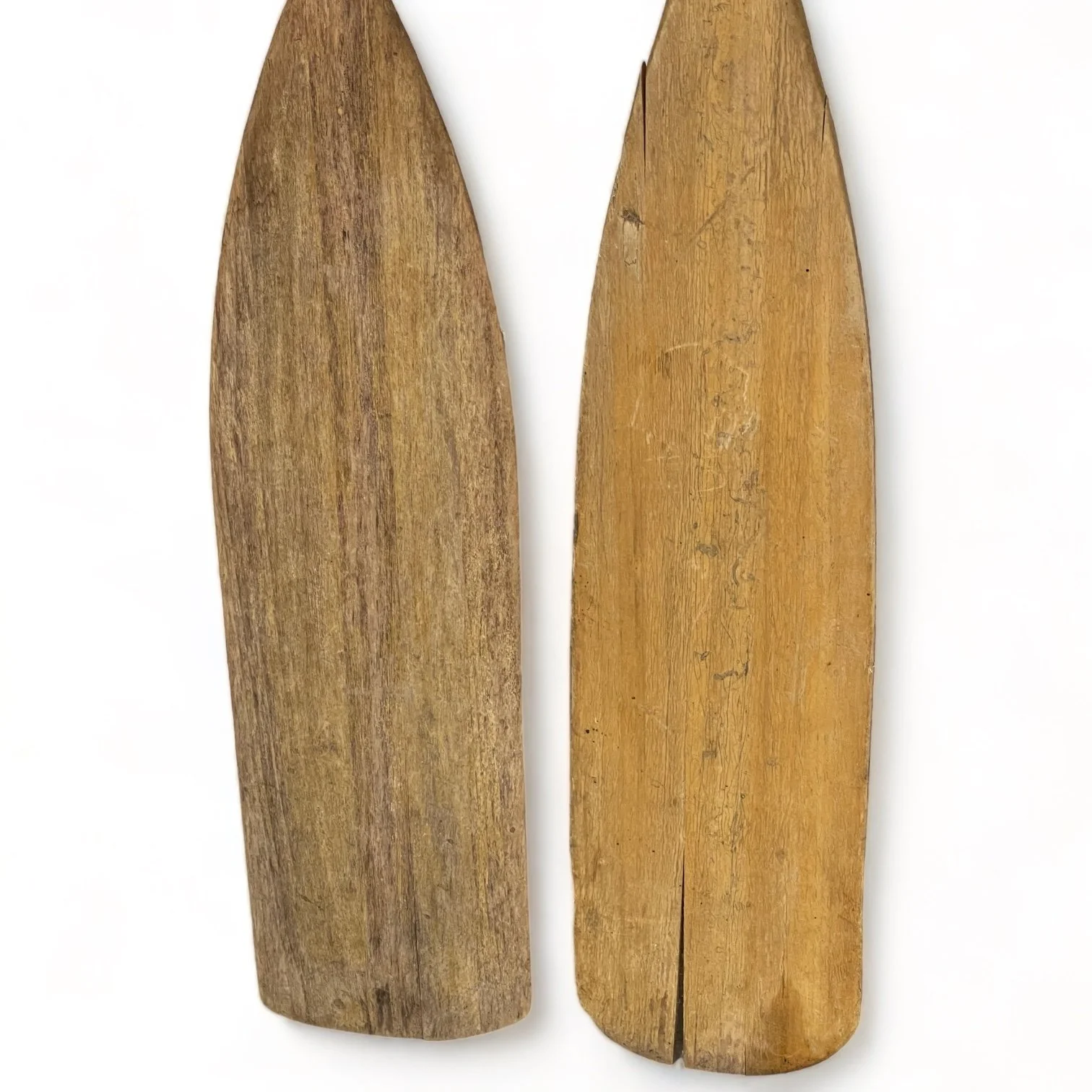 Pair of mismatched 59 inch weathered wooden boat oars, perfect for beach house or coastal living and nautical decor.