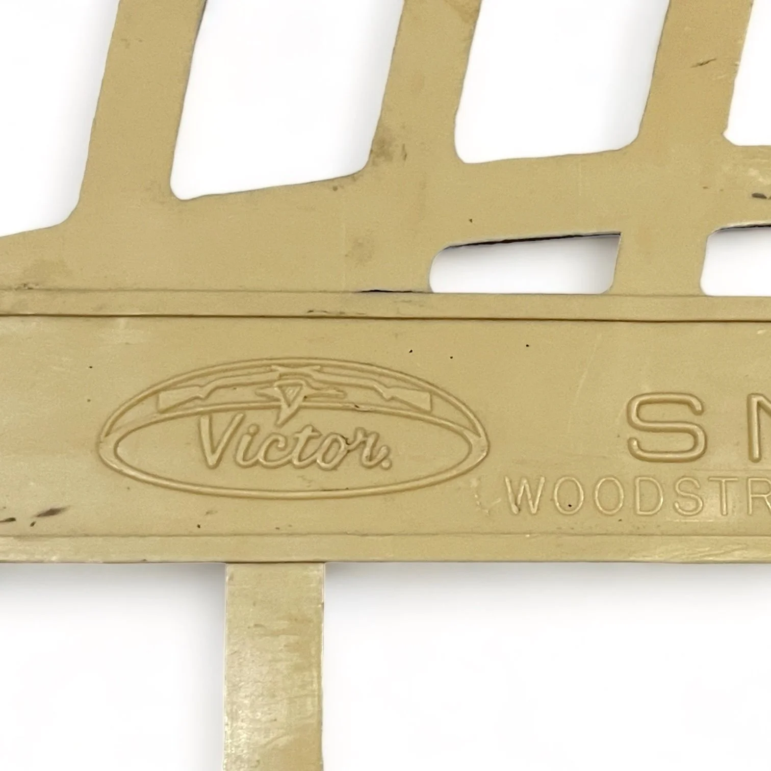 Pair of beige plastic Victor snowshoes with leather bindings.