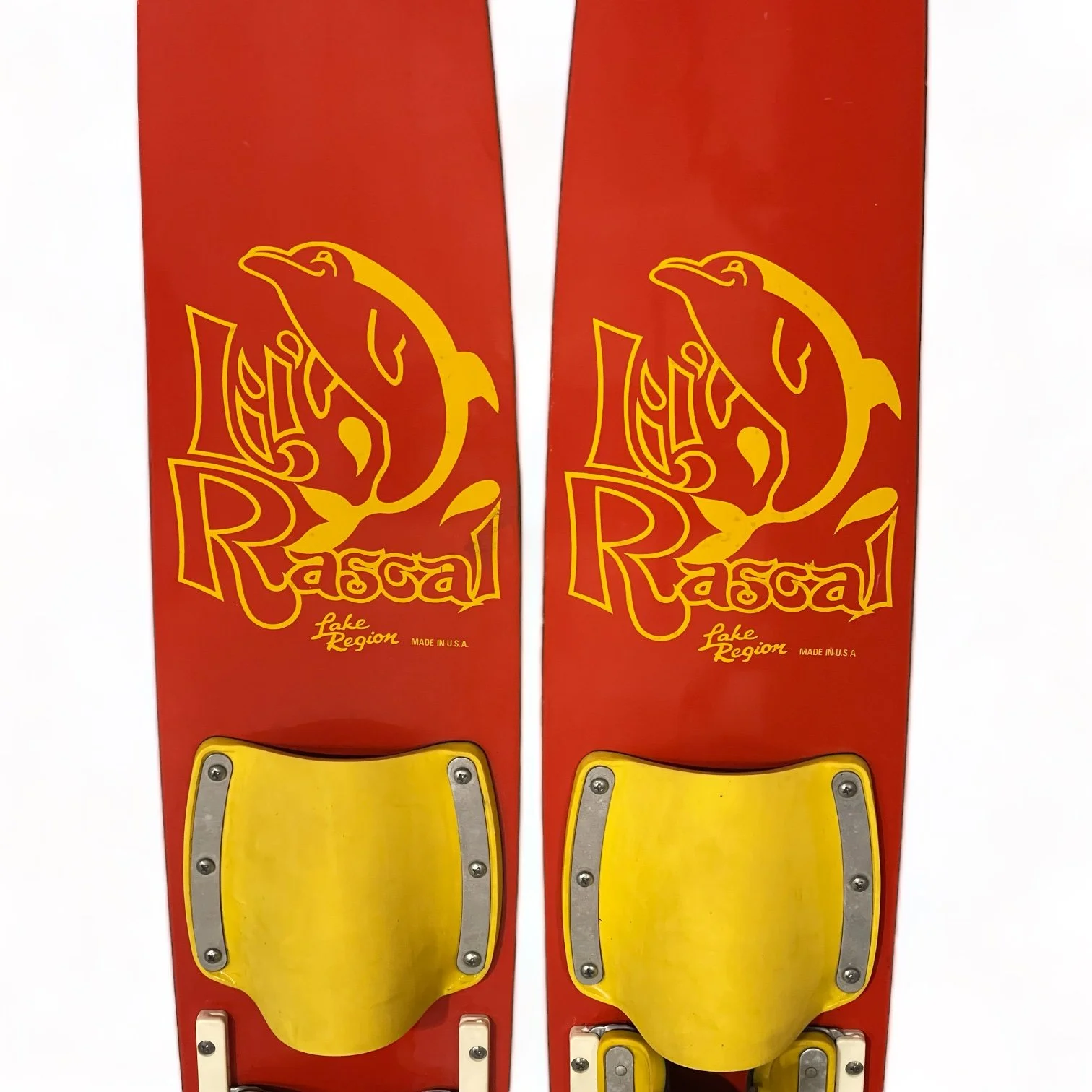 Vintage red and yellow Lil Rascal wooden water skis for kids with a dolphin logo by Lake Region. Made in USA