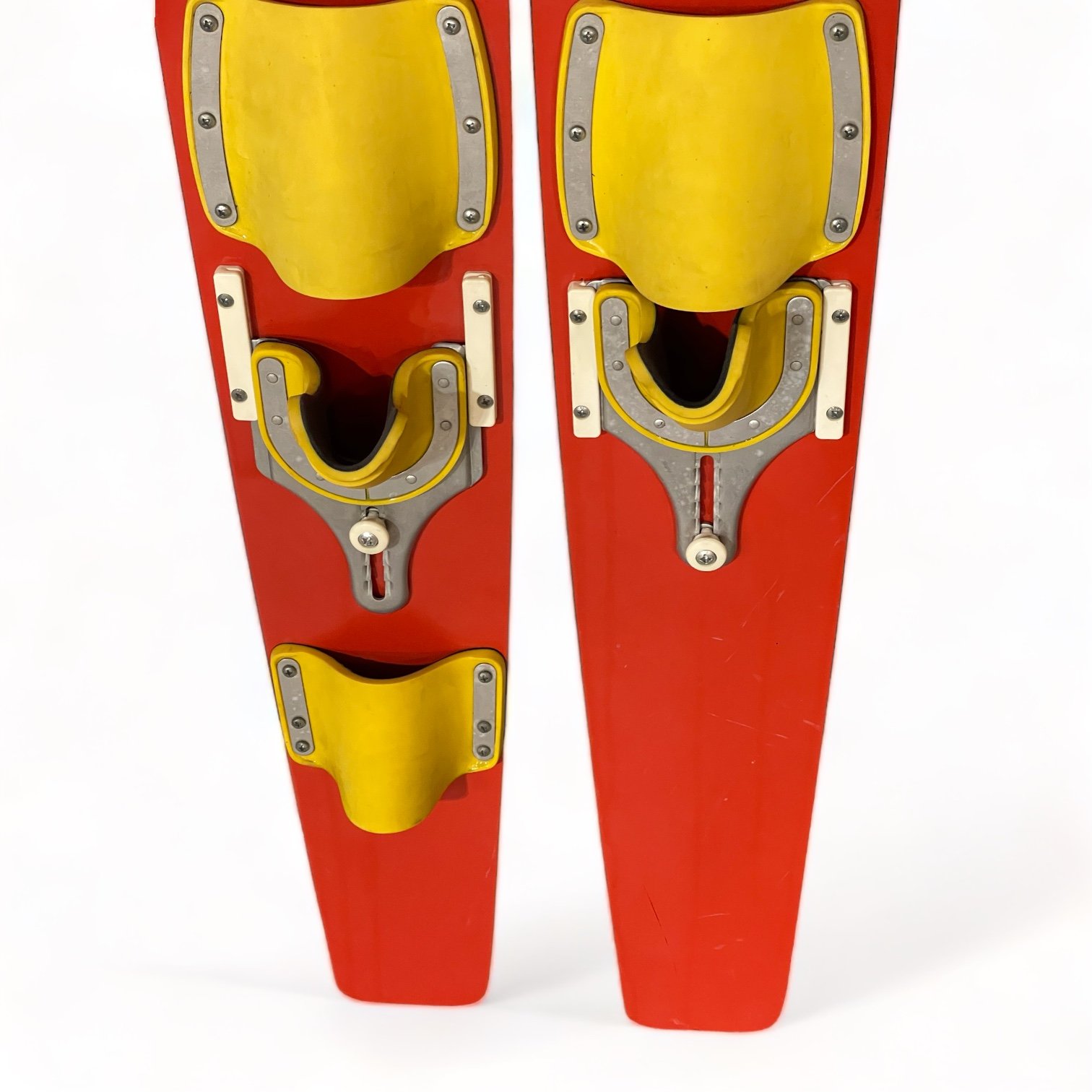 Vintage red and yellow Lil Rascal wooden water skis for kids with a dolphin logo by Lake Region. Made in USA