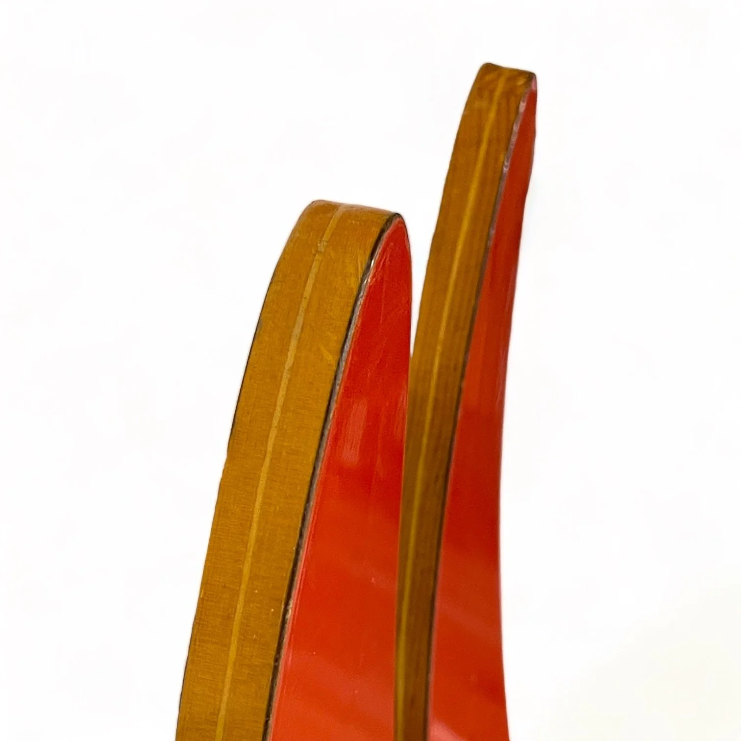 Vintage red and yellow Lil Rascal wooden water skis for kids with a dolphin logo by Lake Region. Made in USA
