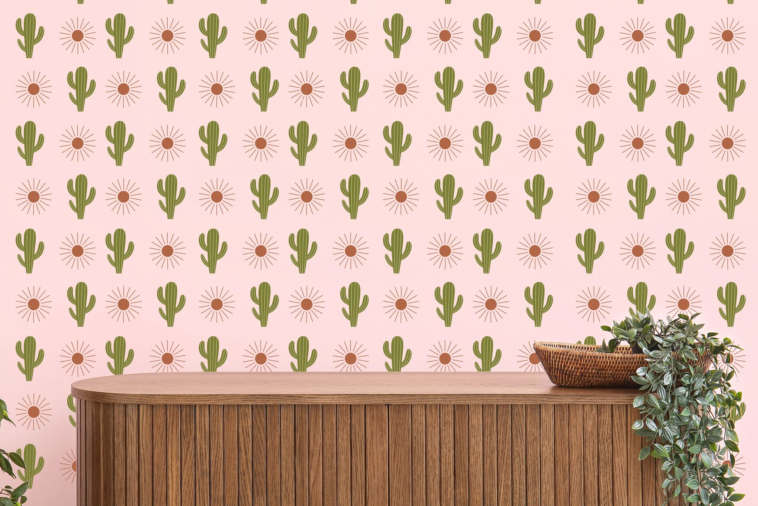 Cactus and sun removable vinyl wall decals, boho inspired shown in olive and nut brown on a light pink wall above a credenza.