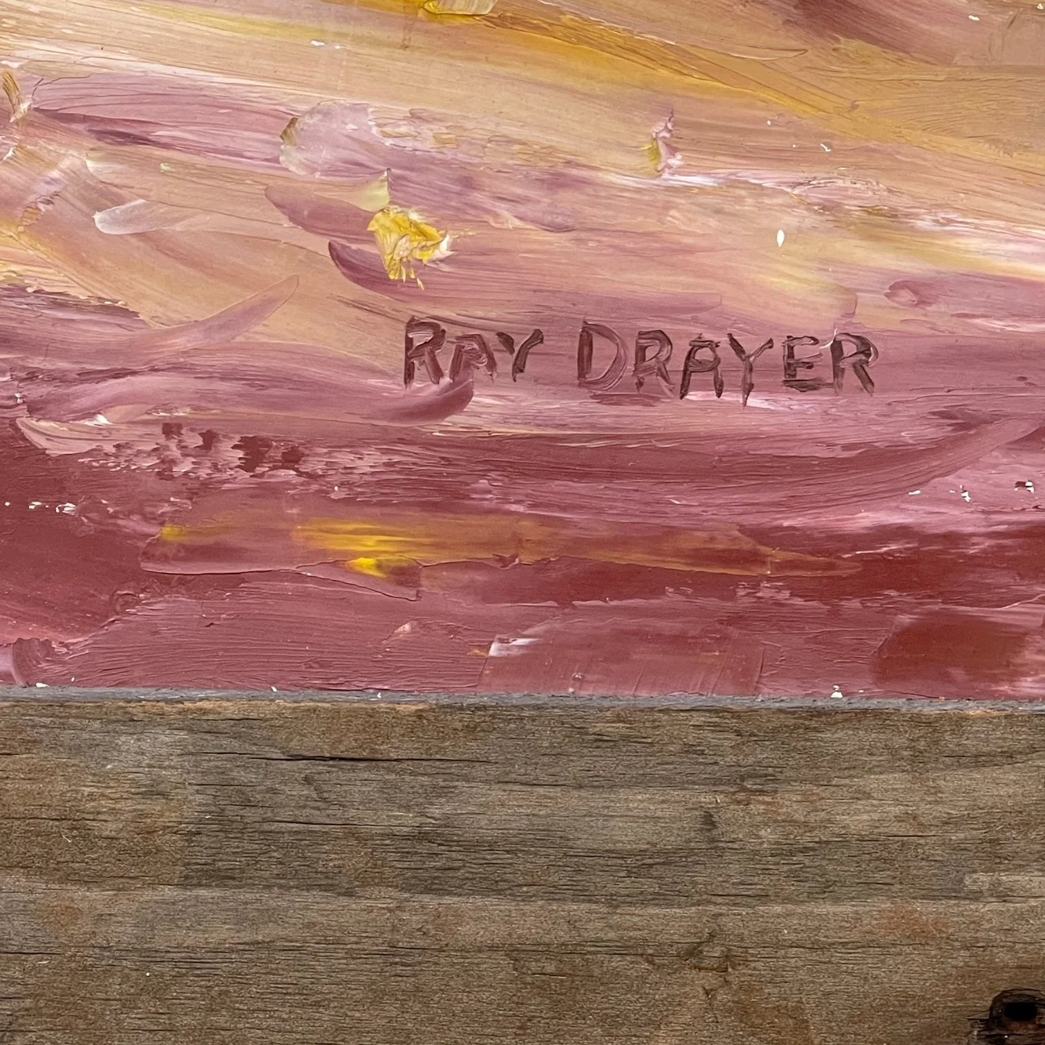 Vintage colorful arid desert painting framed in rustic wood frame.