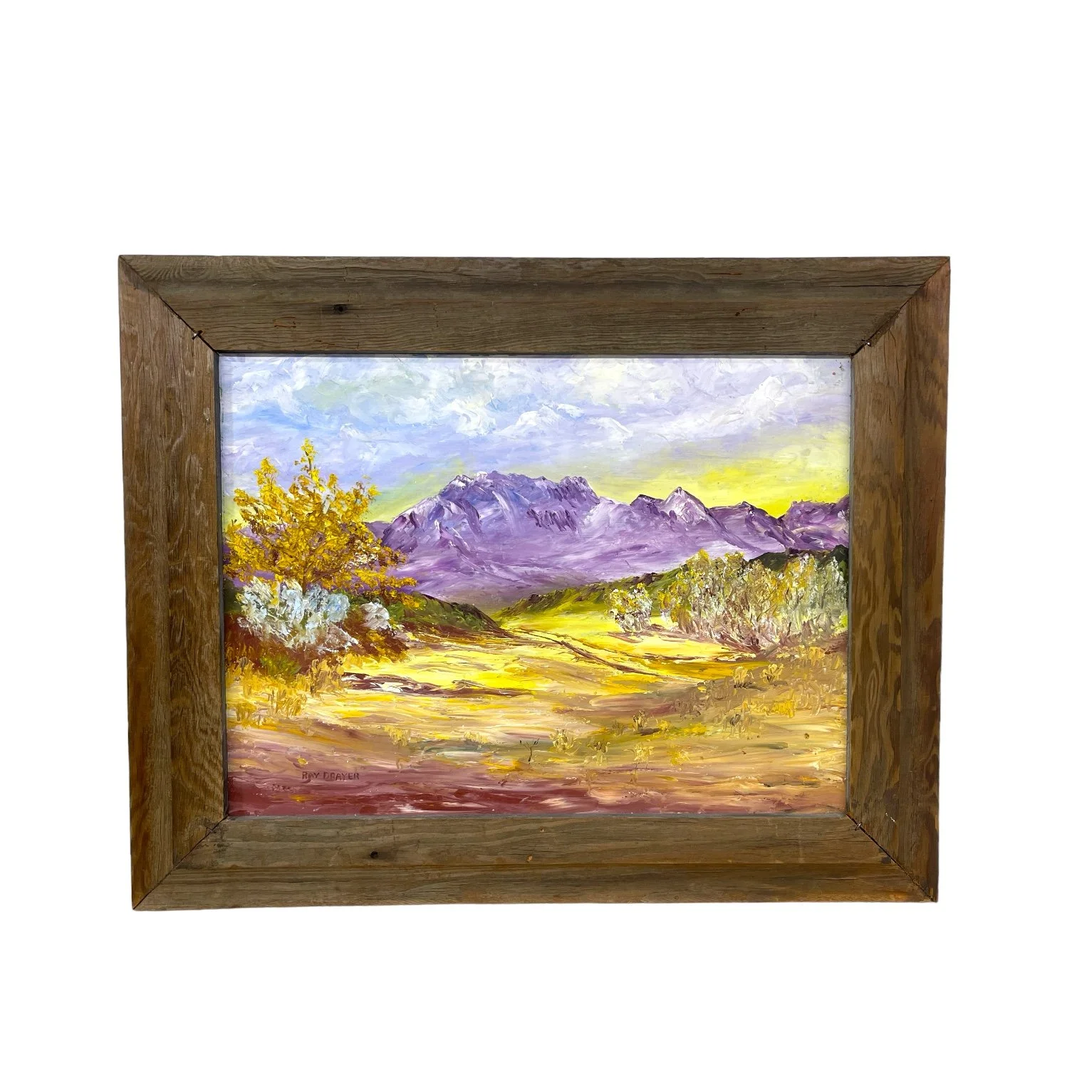 Vintage colorful arid desert painting framed in rustic wood frame.