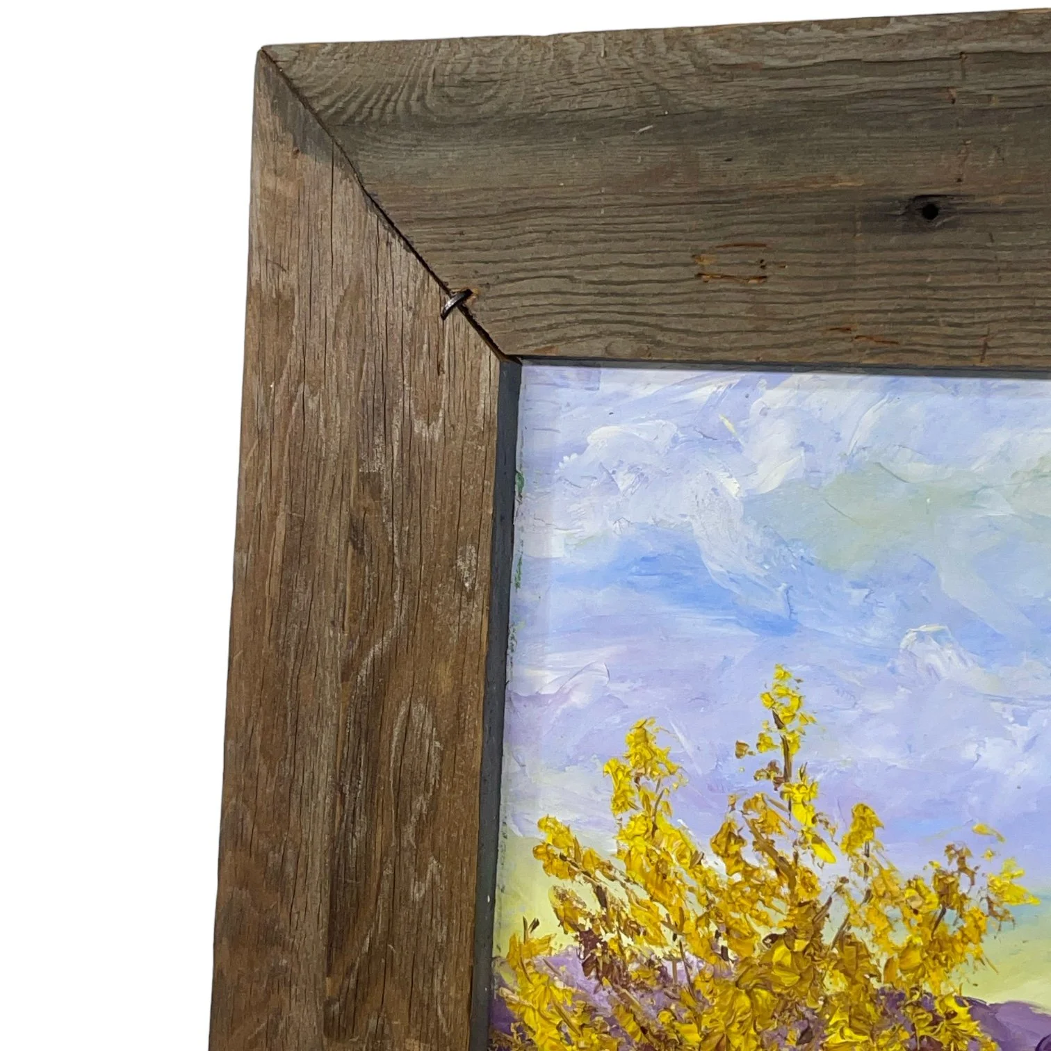 Vintage colorful arid desert painting framed in rustic wood frame.
