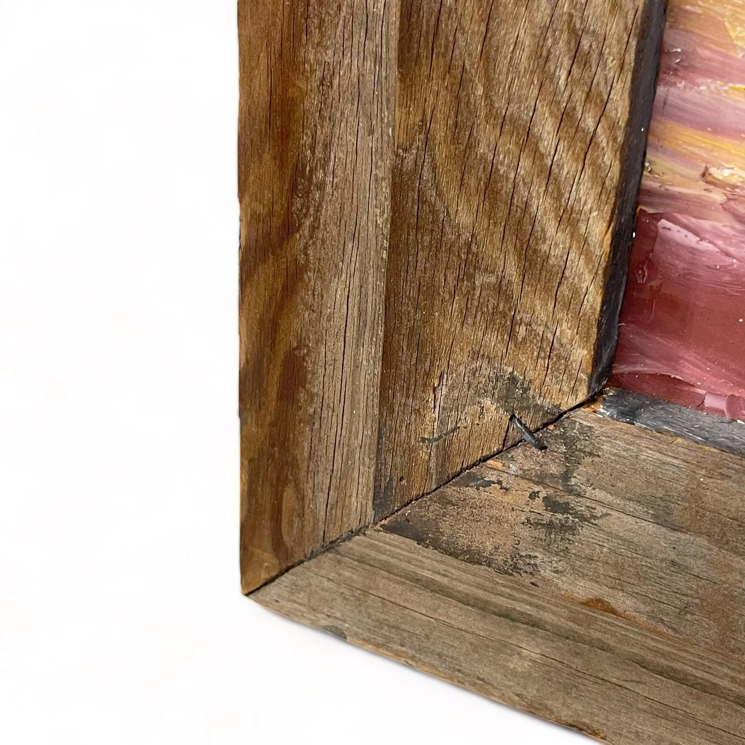 Vintage colorful arid desert painting framed in rustic wood frame.