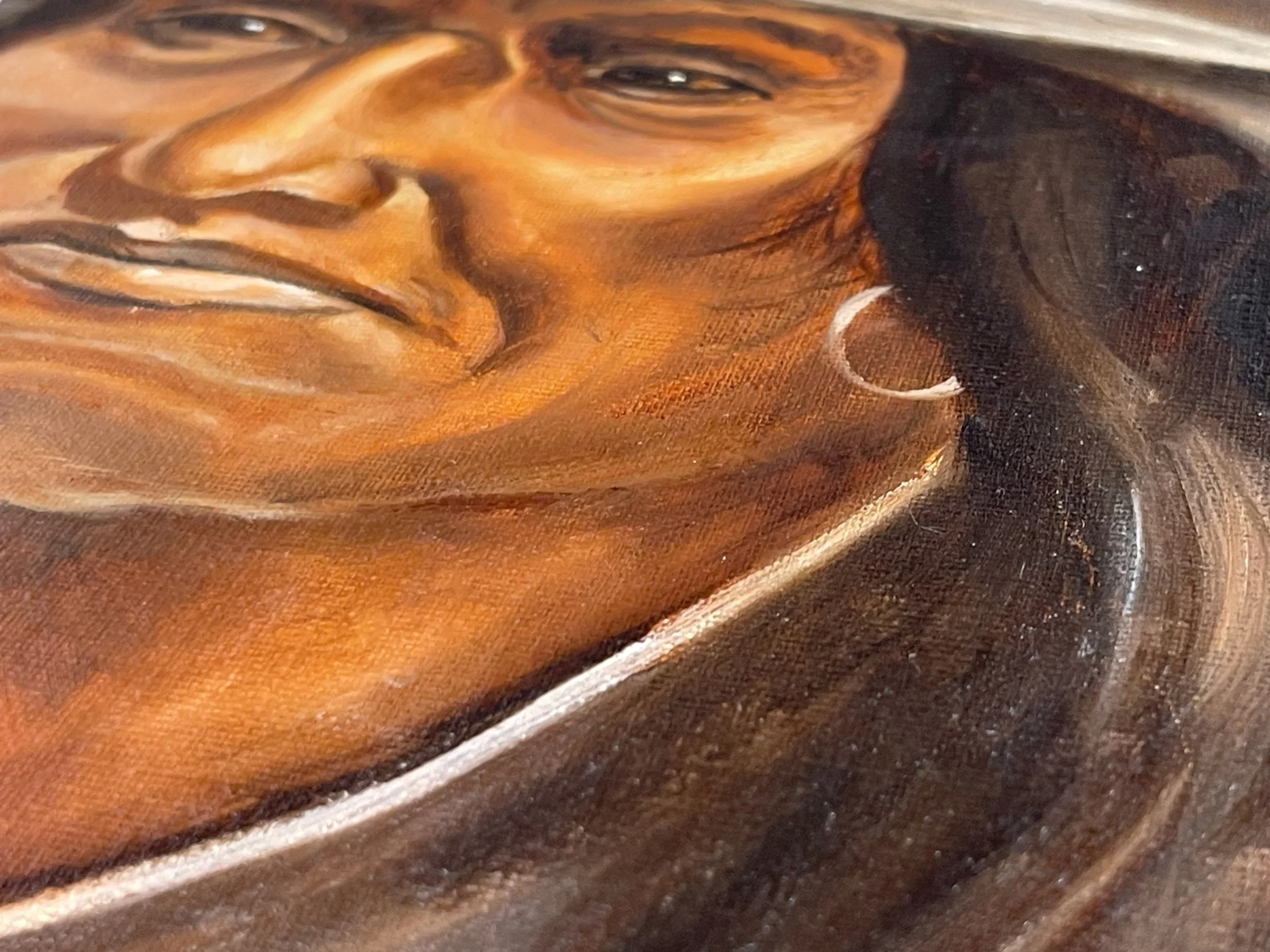 Vintage framed Painting of Native Man in Western Hat signed by artist. Painting is done in a combination of earth tone colors.
