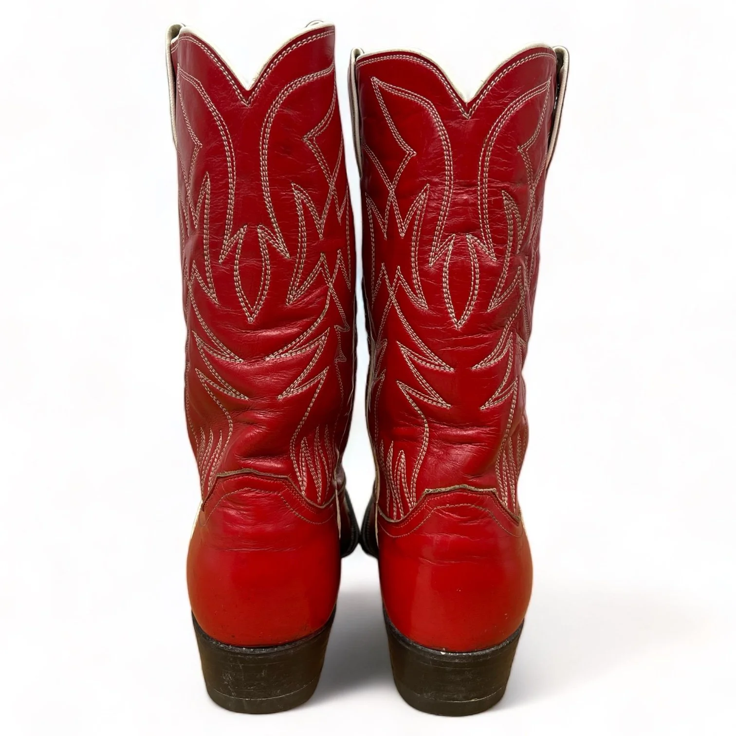 Back view of a vintage pair women's 1970s Justin two toned red and white leather cowboy boots, style L4069, size 8 1/2 B
