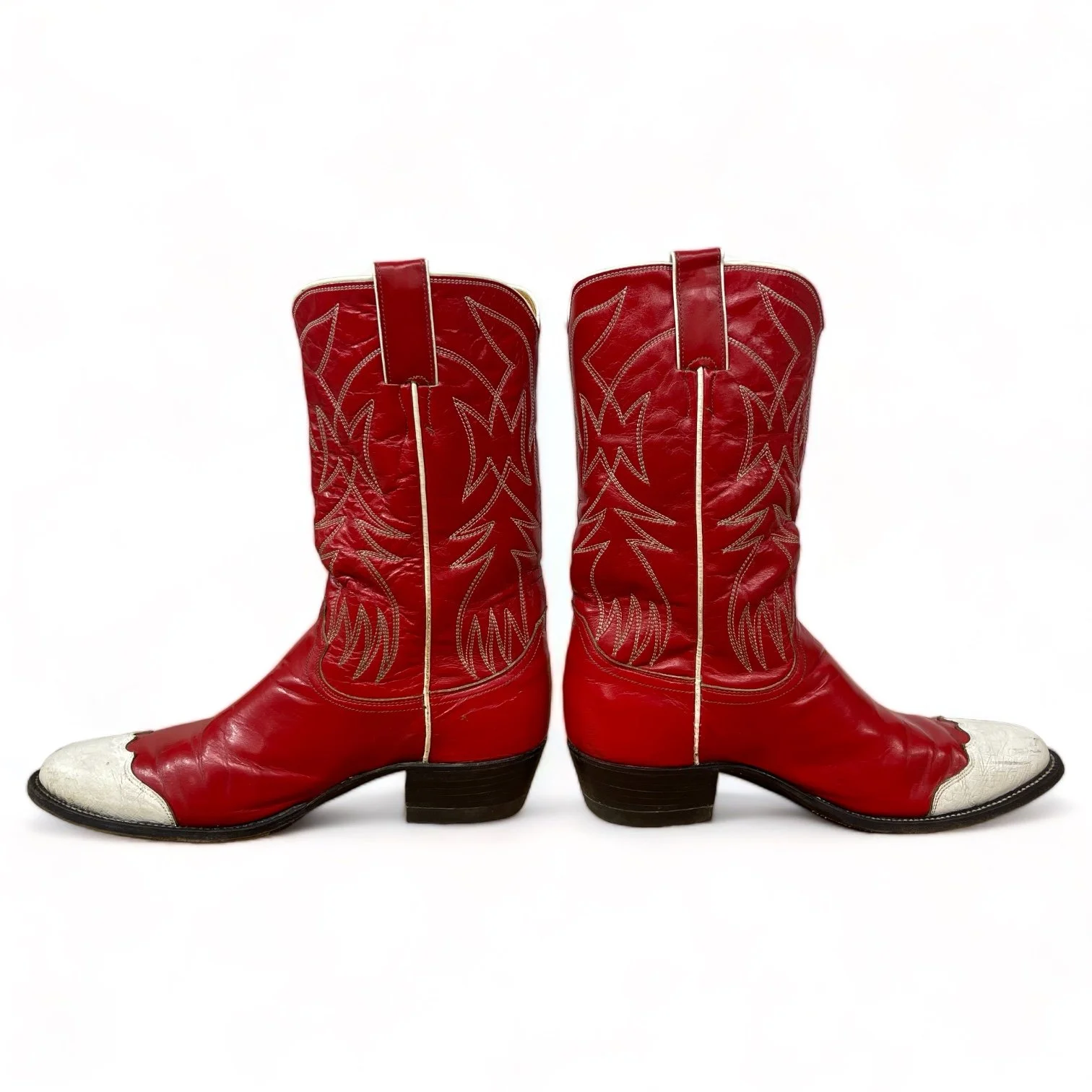 Side view of a vintage pair women's 1970s Justin two toned red and white leather cowboy boots, style L4069, size 8 1/2 B