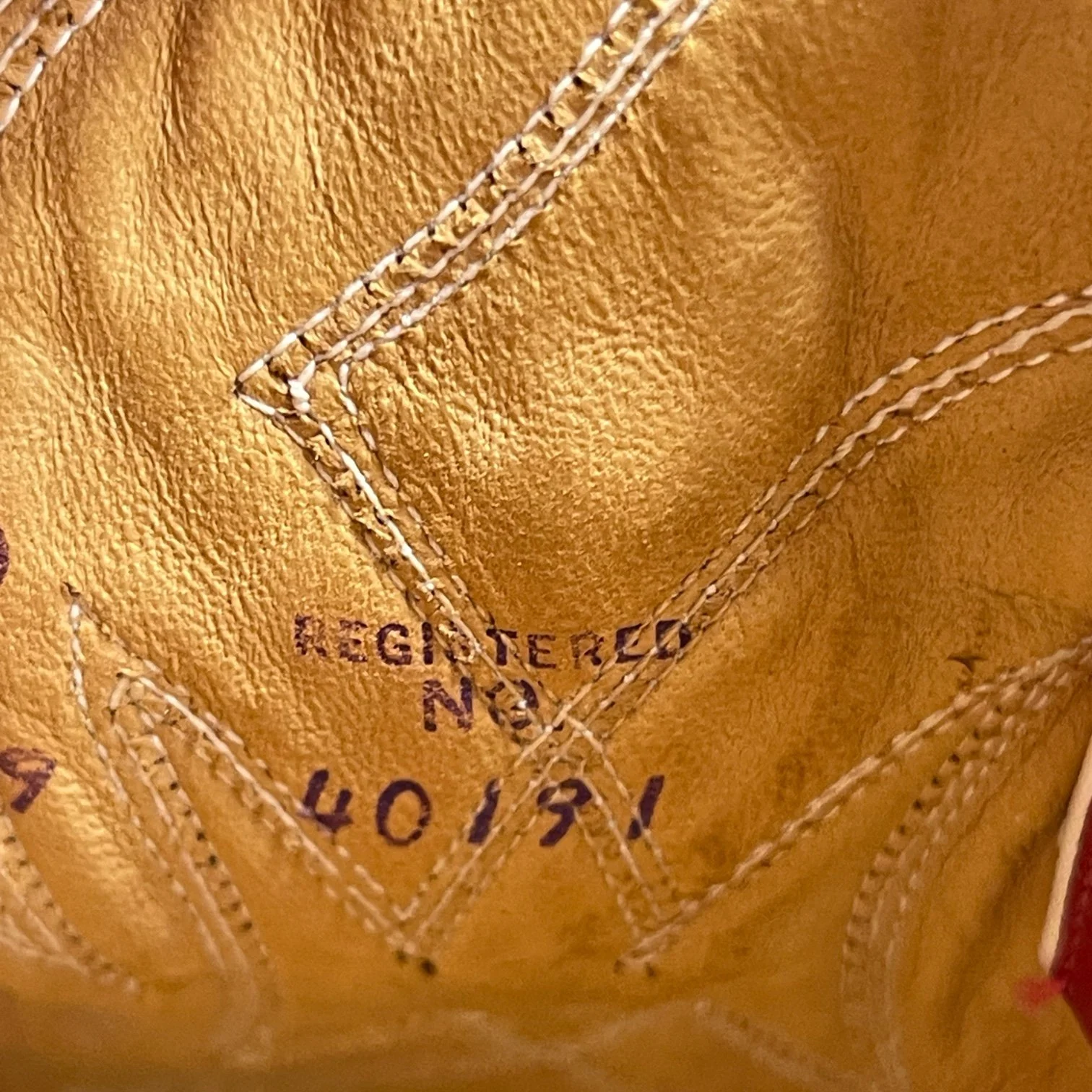 Size, style, registration of a vintage pair women's 1970s Justin two toned red and white leather cowboy boots, style L4069, size 8 1/2 B