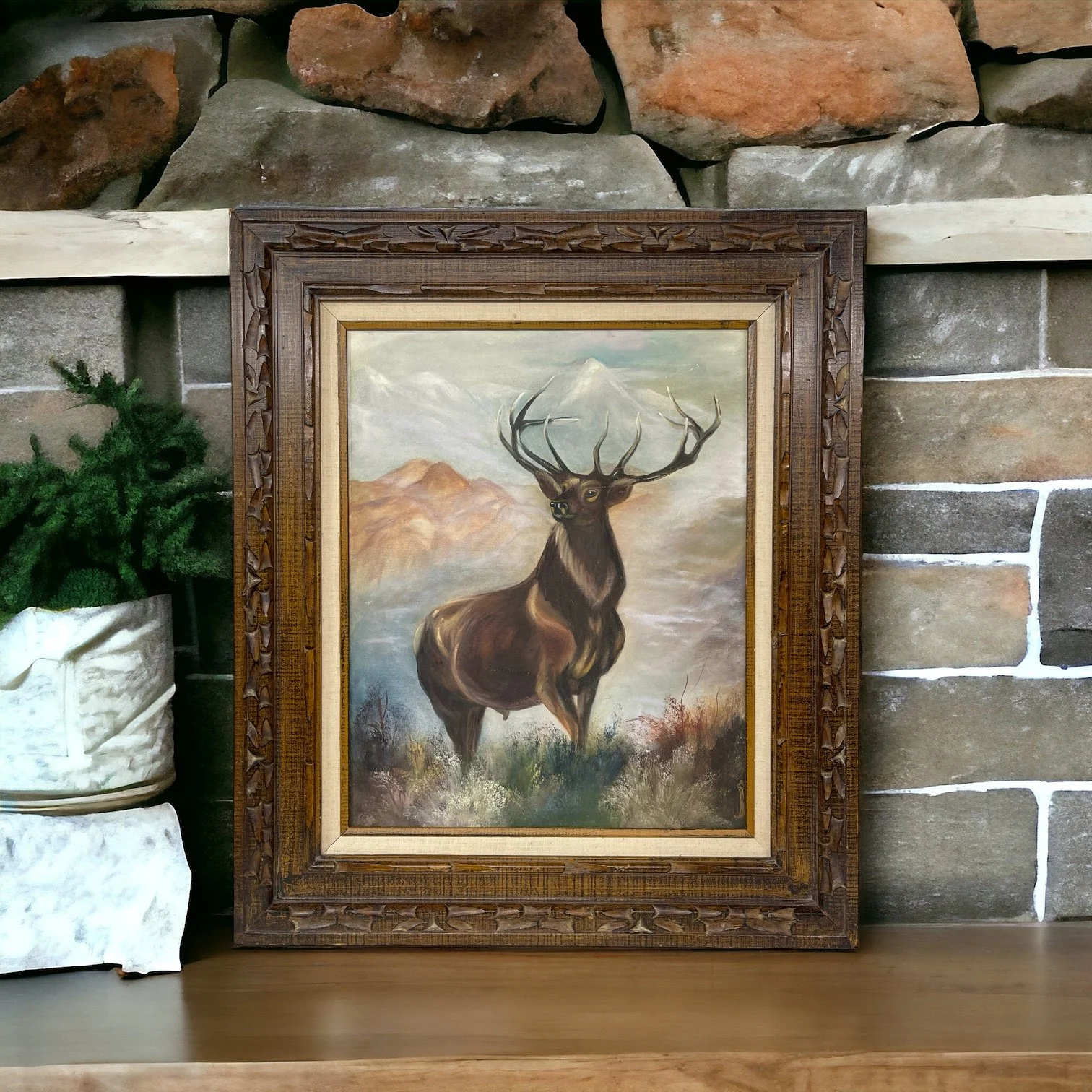 Vintage painting of an elk title 'Trails End' by artist J. Graham, signed and dated 1993. The vertical artwork measures 28x24 inches and is framed in a heavy duty, ornate wood frame.
