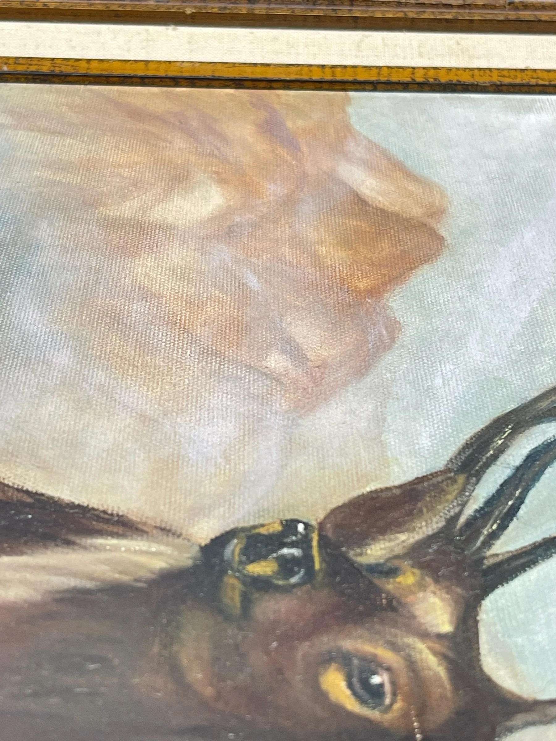 Vintage painting of an elk title 'Trails End' by artist J. Graham, signed and dated 1993. The vertical artwork measures 28x24 inches and is framed in a heavy duty, ornate wood frame.