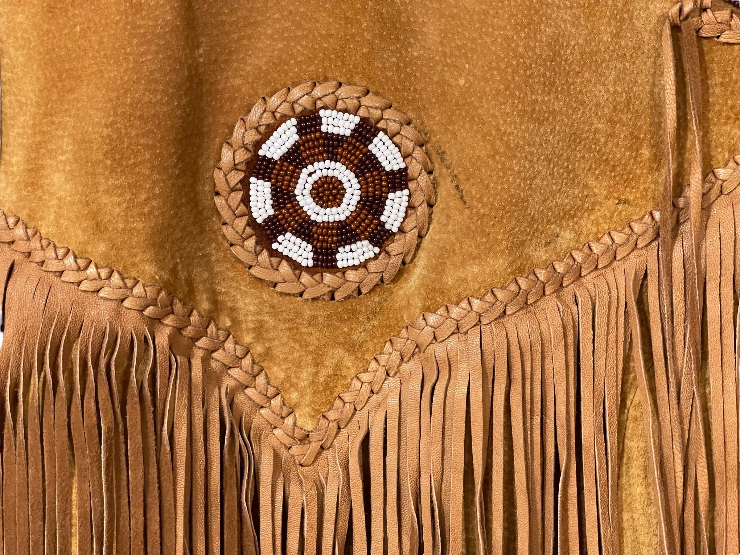 Close up beaded work on a vintage Echo Mountain Arturo Suede Fringe and Beaded Jacket Size 36, Western Wear Made in Mexico