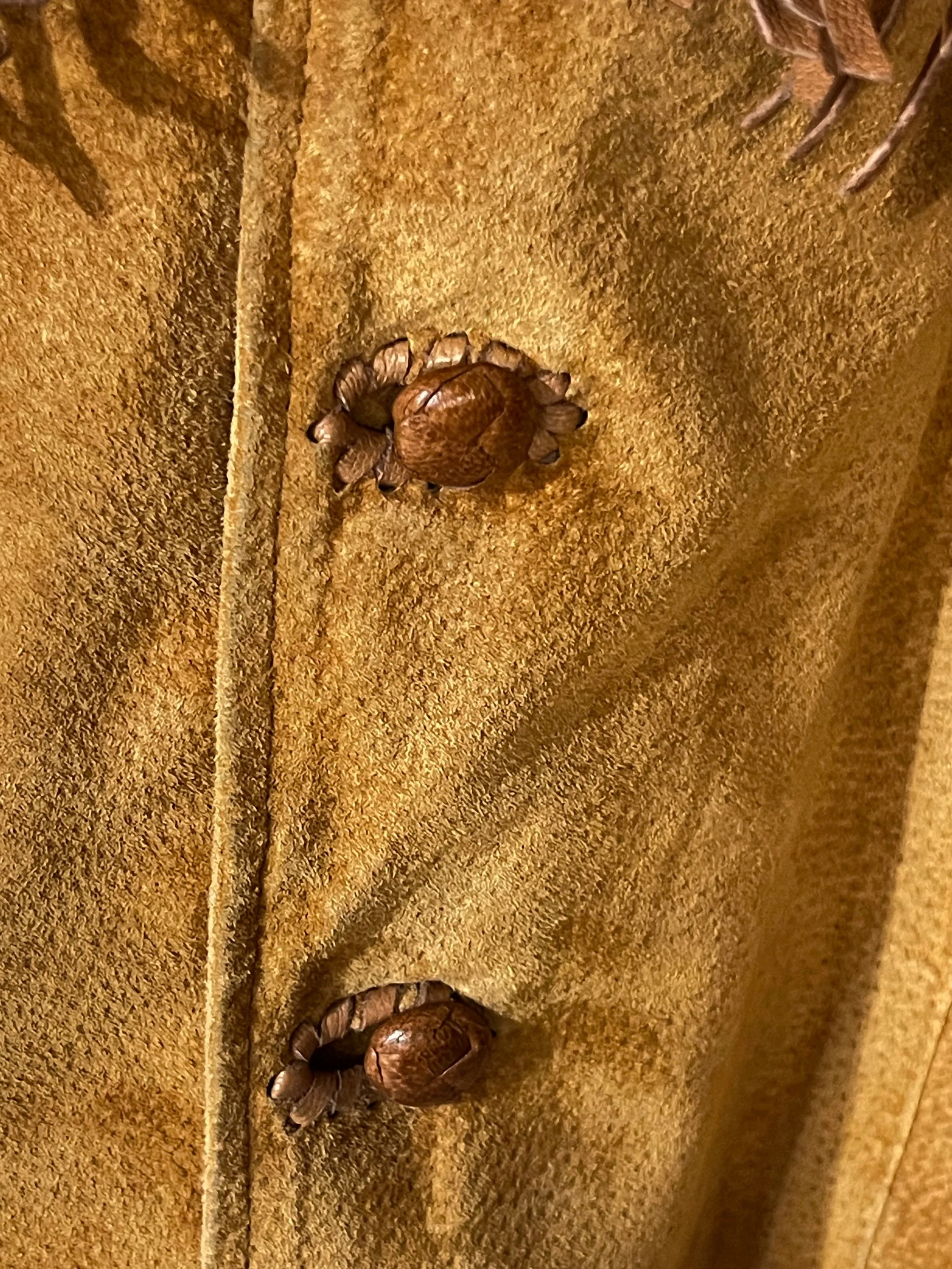 Close up of buttons on a vintage Echo Mountain Arturo Suede Fringe and Beaded Jacket Size 36, Western Wear Made in Mexico