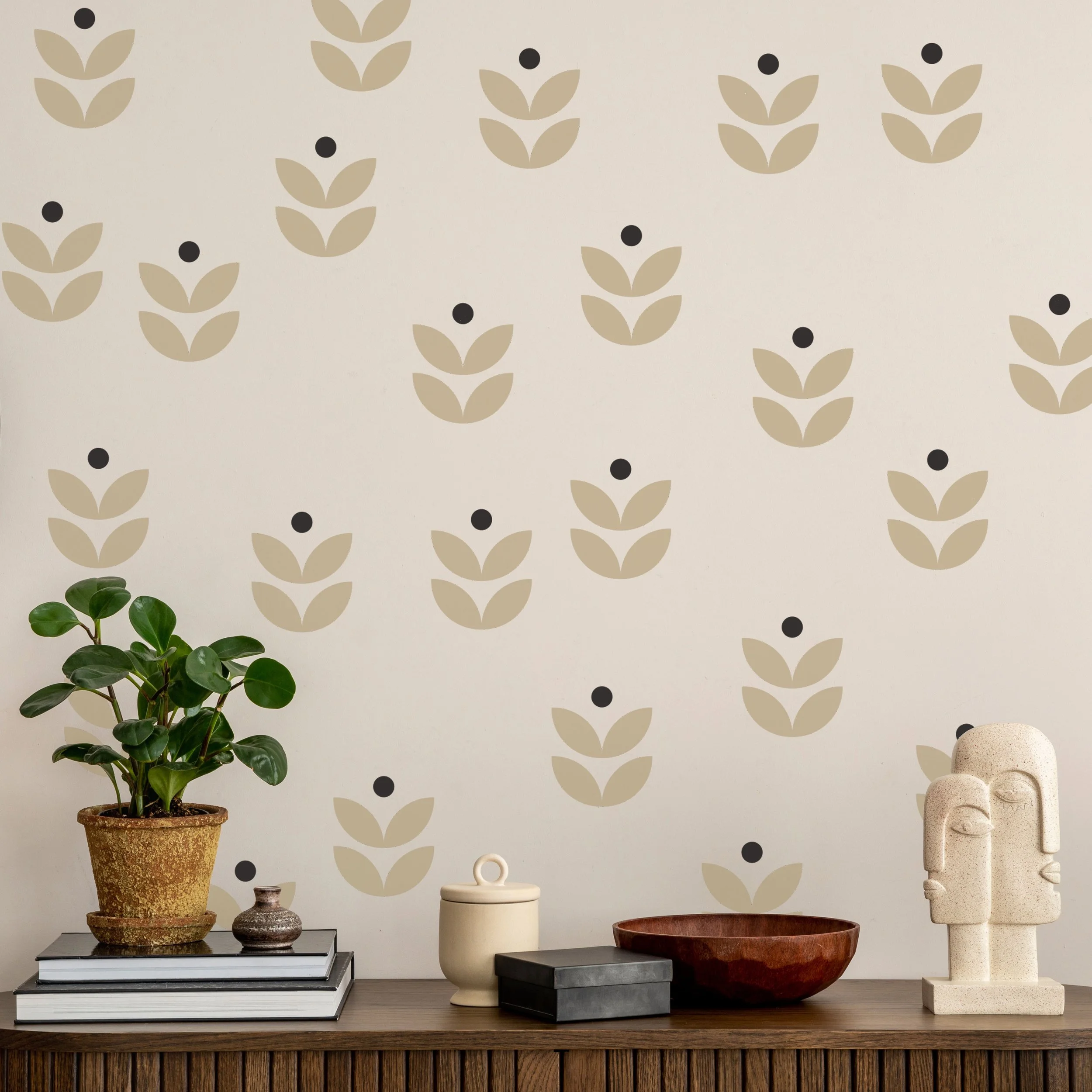 Minimalist botanical wall decals in a boho scandi modern style in a living room above a entertainment unit.