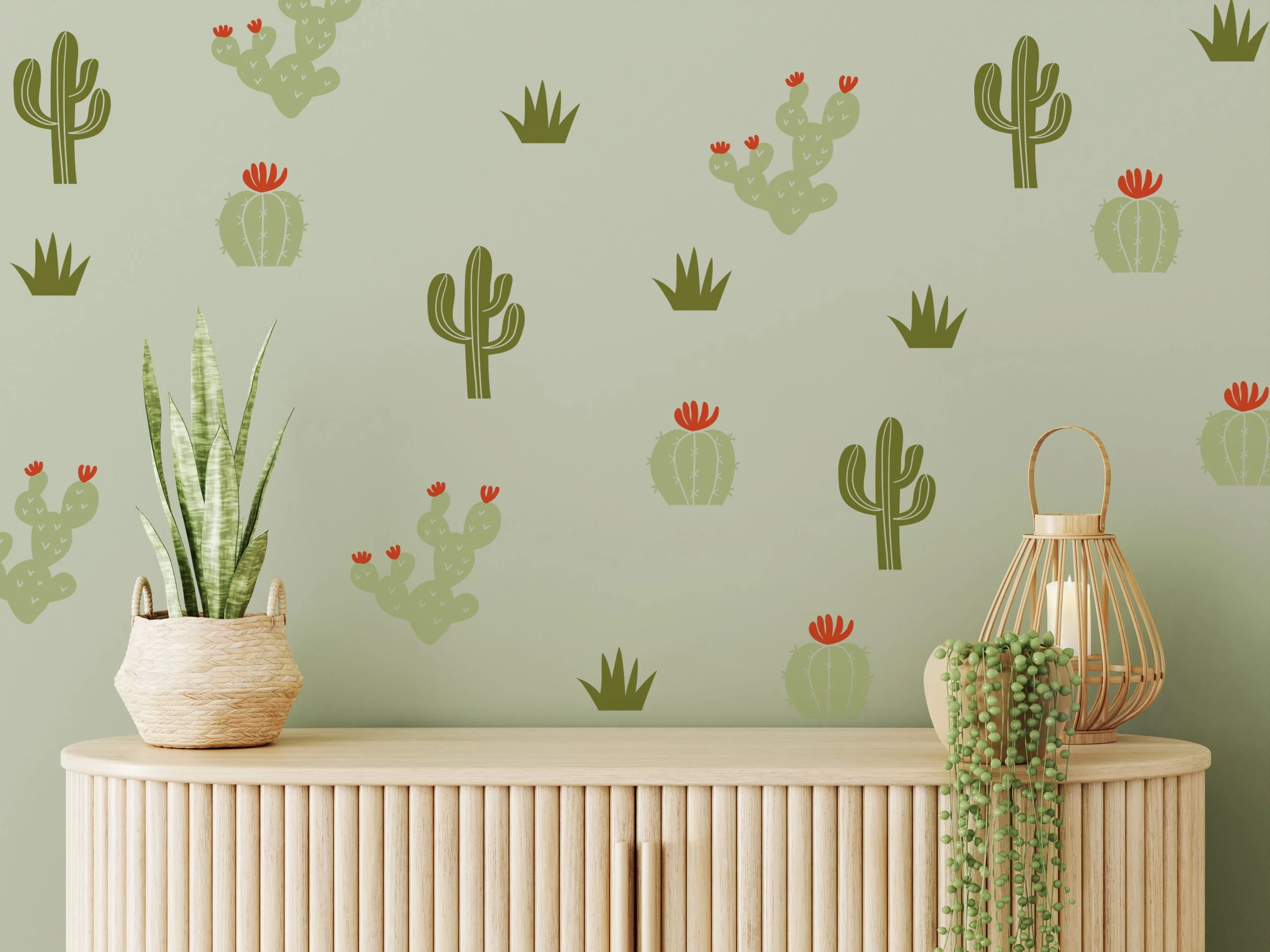 Colorful and stylish cactus 3 color wall decal set on a light green sage wall above a light wood table in a boho living room.