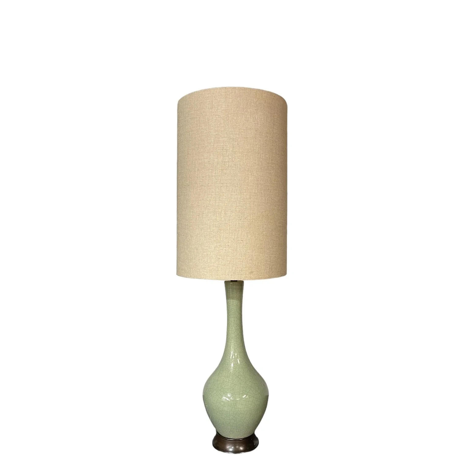 Vintage extra large mid century crackle glaze table lamp in a seafoam green color with an oversize vintage cylinder shade.