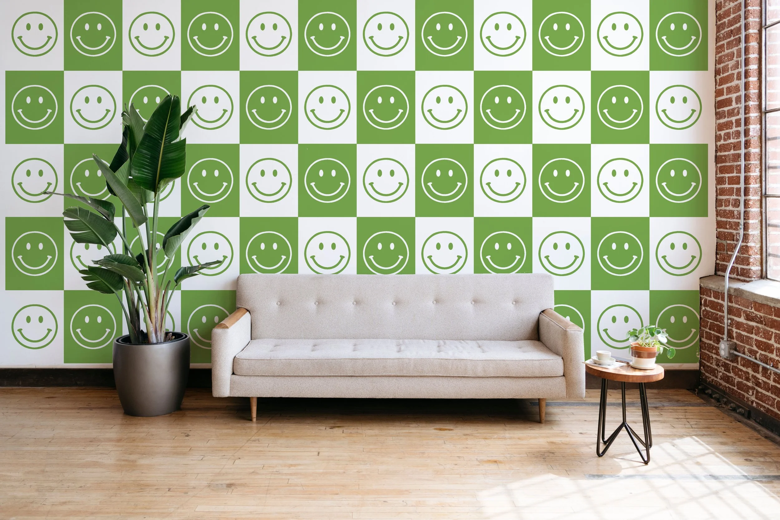 Lime green smiley face repeat pattern wall decals installed on the wall of a modern loft living room.