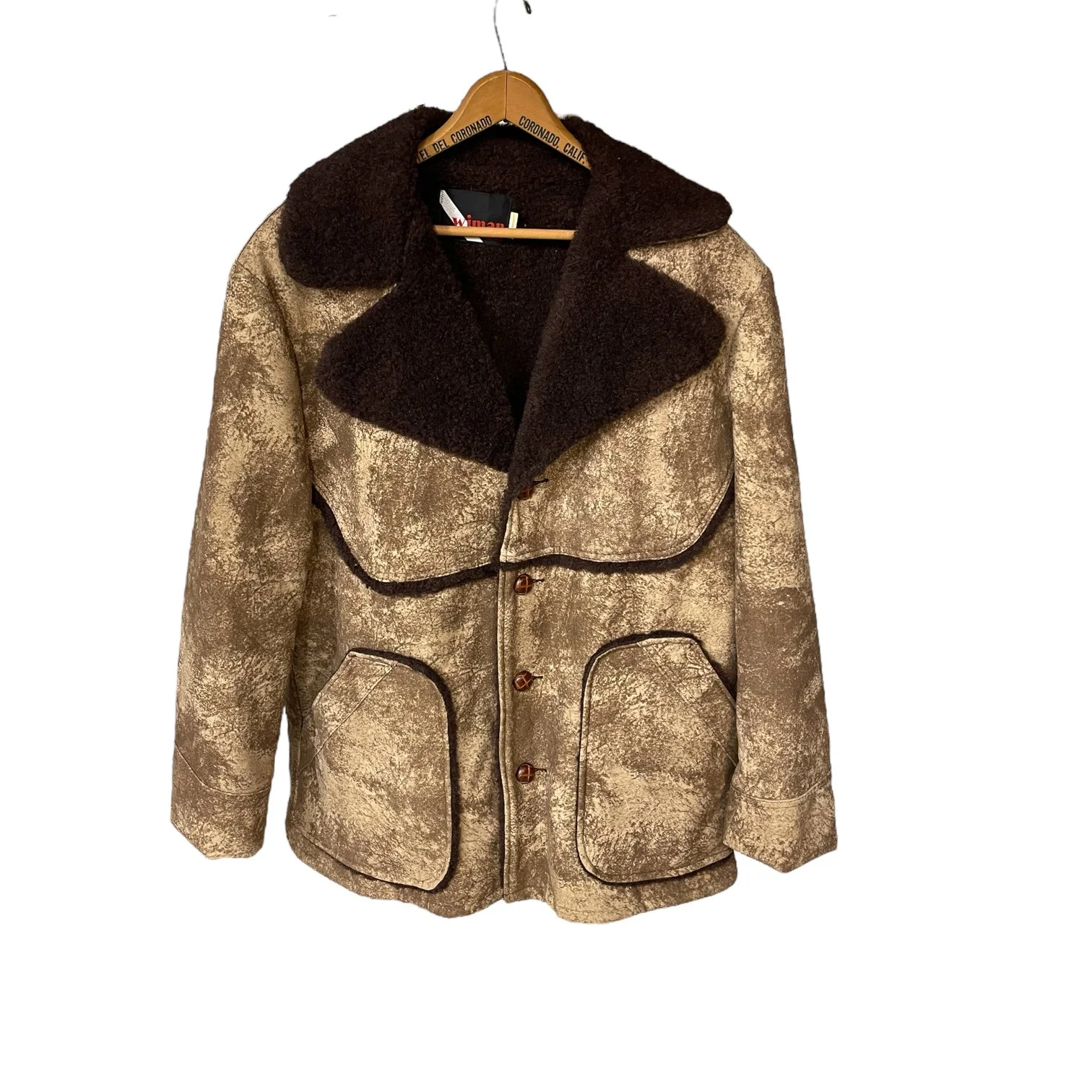A vintage men's Sherpa Lined Rancher Jacket hanging on a vintage wooden hanger. Size XL Made in USA, Classic Ranch Style Western Wear, by Wiman.