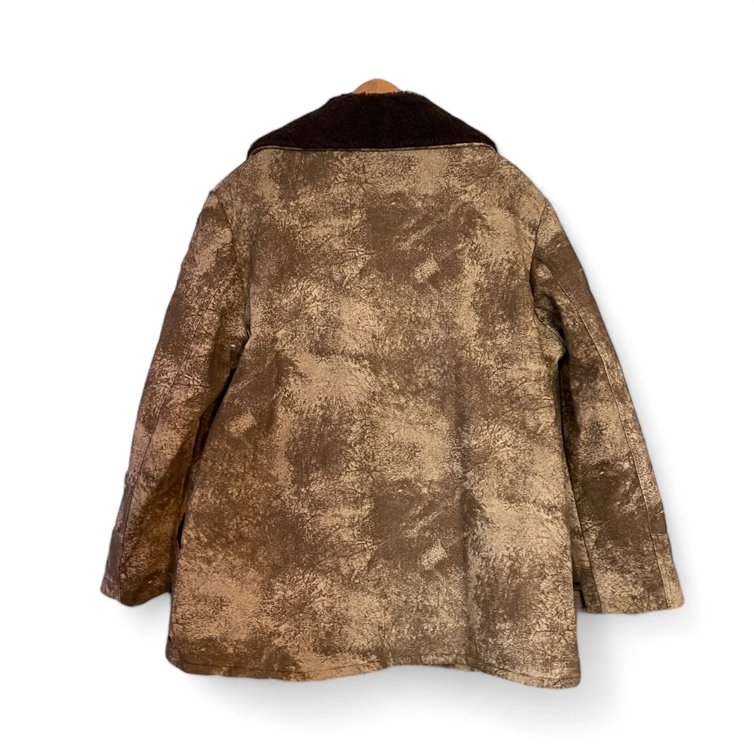 A vintage men's Sherpa Lined Rancher Jacket hanging on a vintage wooden hanger. Size XL Made in USA, Classic Ranch Style Western Wear, by Wiman.