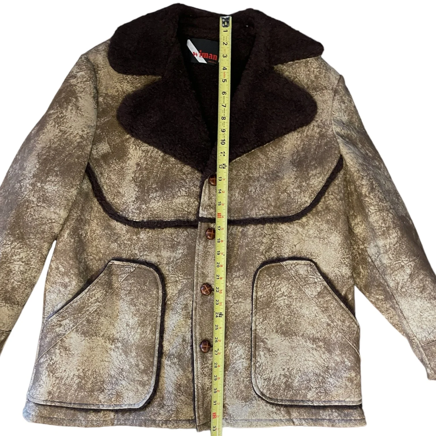 A vintage men's Sherpa Lined Rancher Jacket hanging on a vintage wooden hanger. Size XL Made in USA, Classic Ranch Style Western Wear, by Wiman.