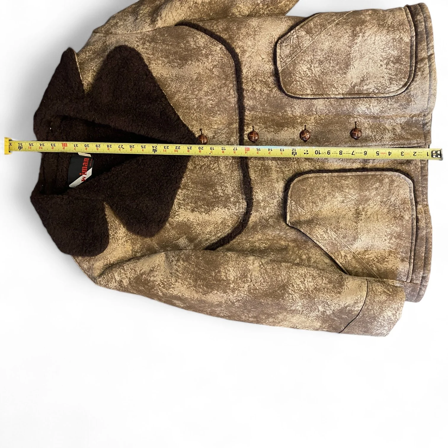 A vintage men's Sherpa Lined Rancher Jacket hanging on a vintage wooden hanger. Size XL Made in USA, Classic Ranch Style Western Wear, by Wiman.