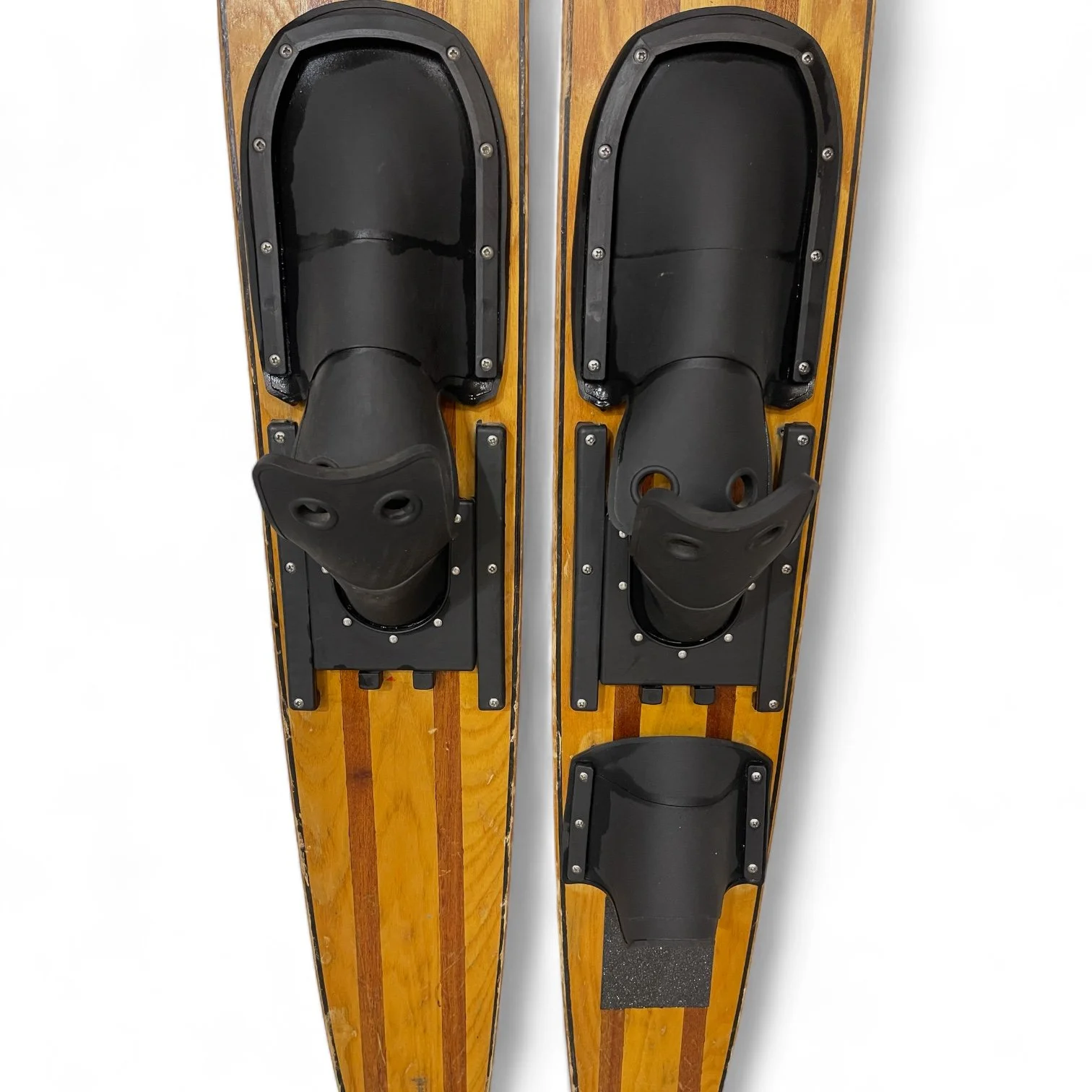 1960 pair vintage wooden water skis by Lund, Capri Chuck Stearns model. Wood grain front with red painted backside. Includes original black rubber and metal bindings.