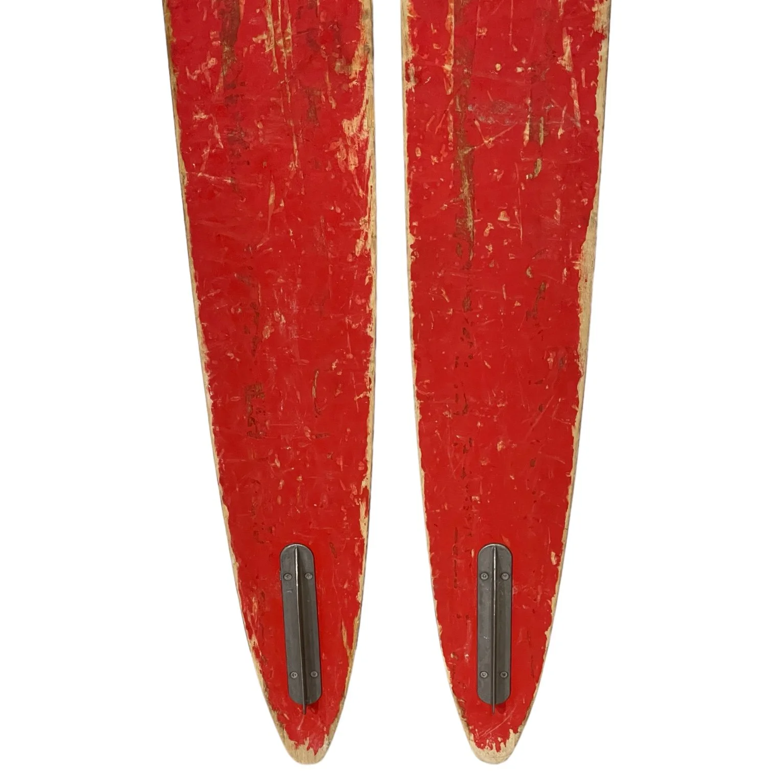 1960 pair vintage wooden water skis by Lund, Capri Chuck Stearns model. Wood grain front with red painted backside. Includes original black rubber and metal bindings.