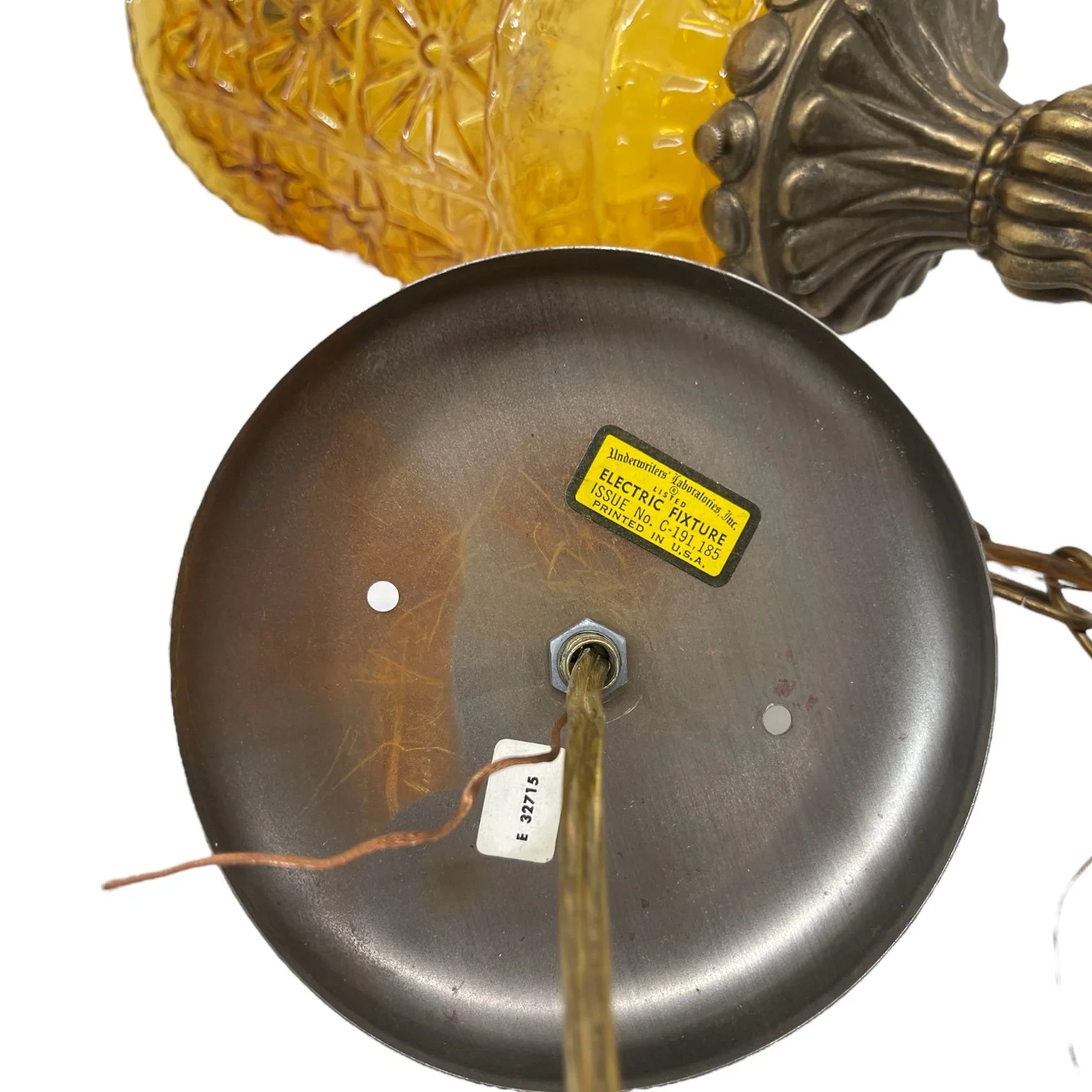 Vintage Mid Century Pendant Hanging Light with chain. Golden Amber Faceted Glass in a geometric floral pattern in a cylinder shape.