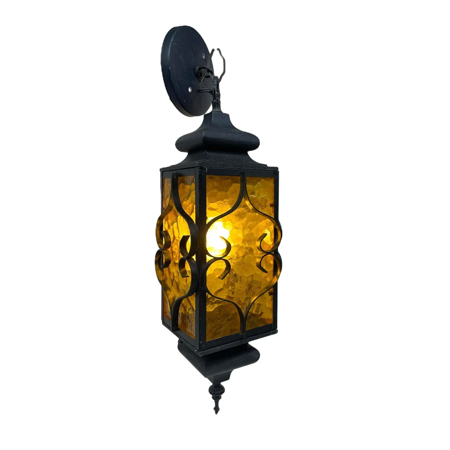 Vintage Spanish Revival hardwired hanging black wrought iron pendant light with amber glass suitable for indoor or outdoor use.