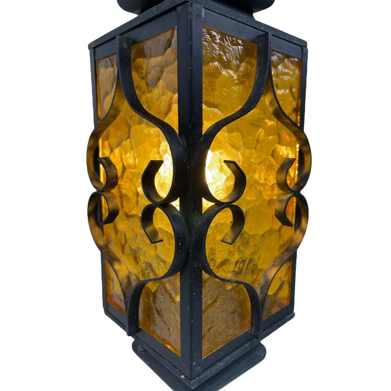 Vintage Spanish Revival hardwired hanging black wrought iron pendant light with amber glass suitable for indoor or outdoor use.