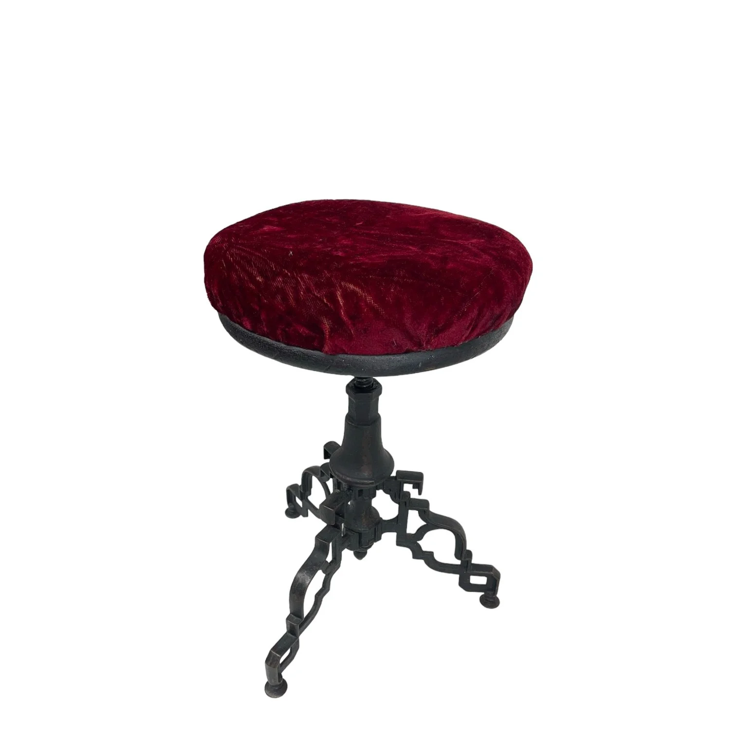 Vintage goth Spanish Revival adjustable stool with cast iron base and a red velvet round seat.