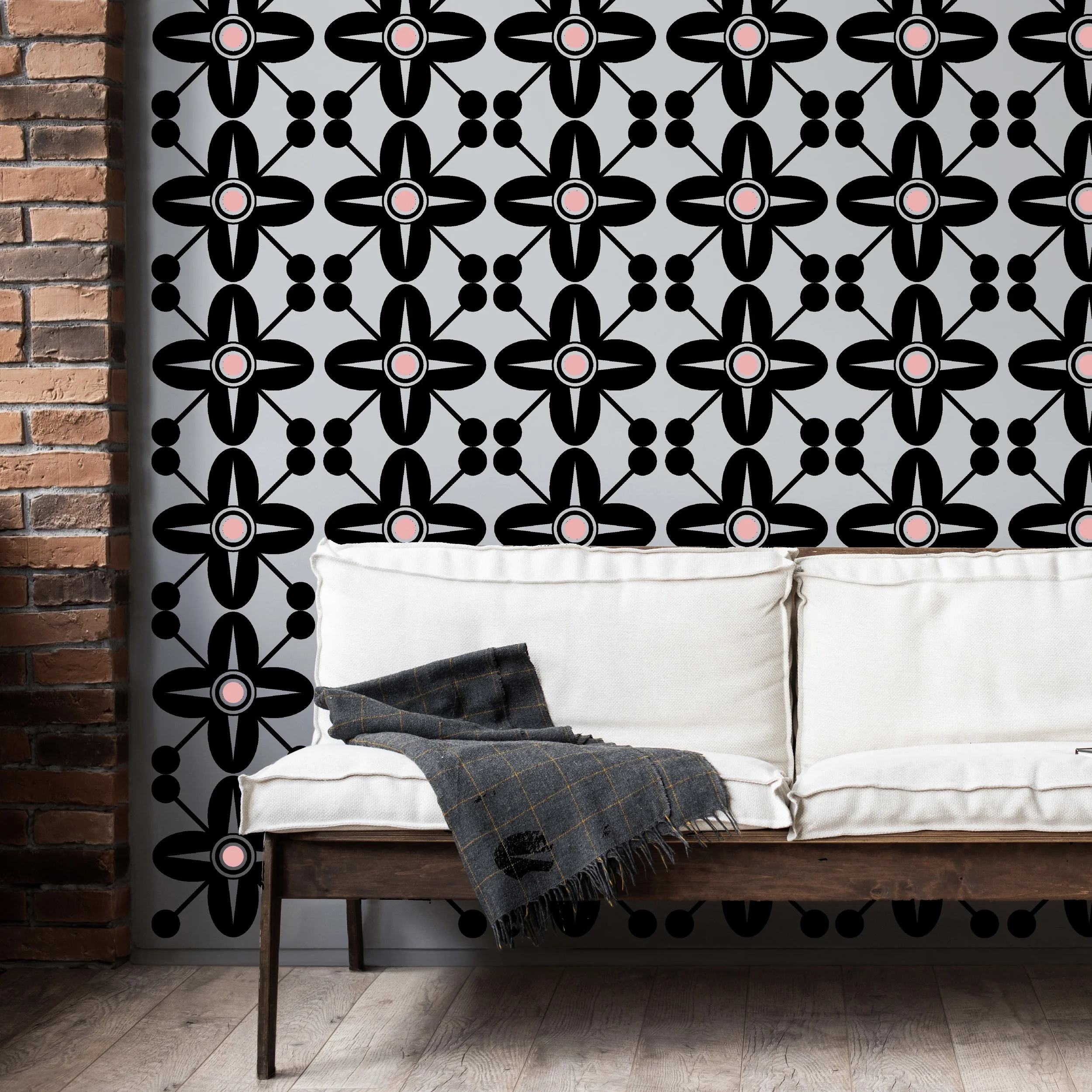 Two color Spanish Revival style wall decal shown in black and carnation pink on a light grey wall of a modern living room.