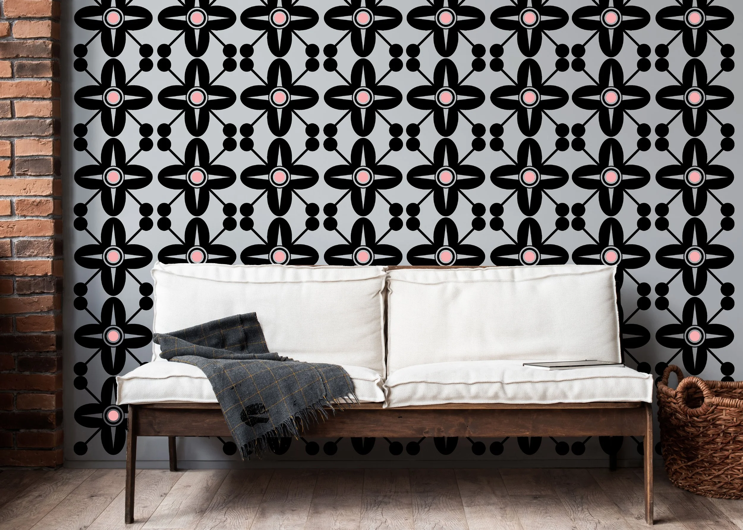 Two color Spanish Revival style wall decal shown in black and carnation pink on a light grey wall of a modern living room.