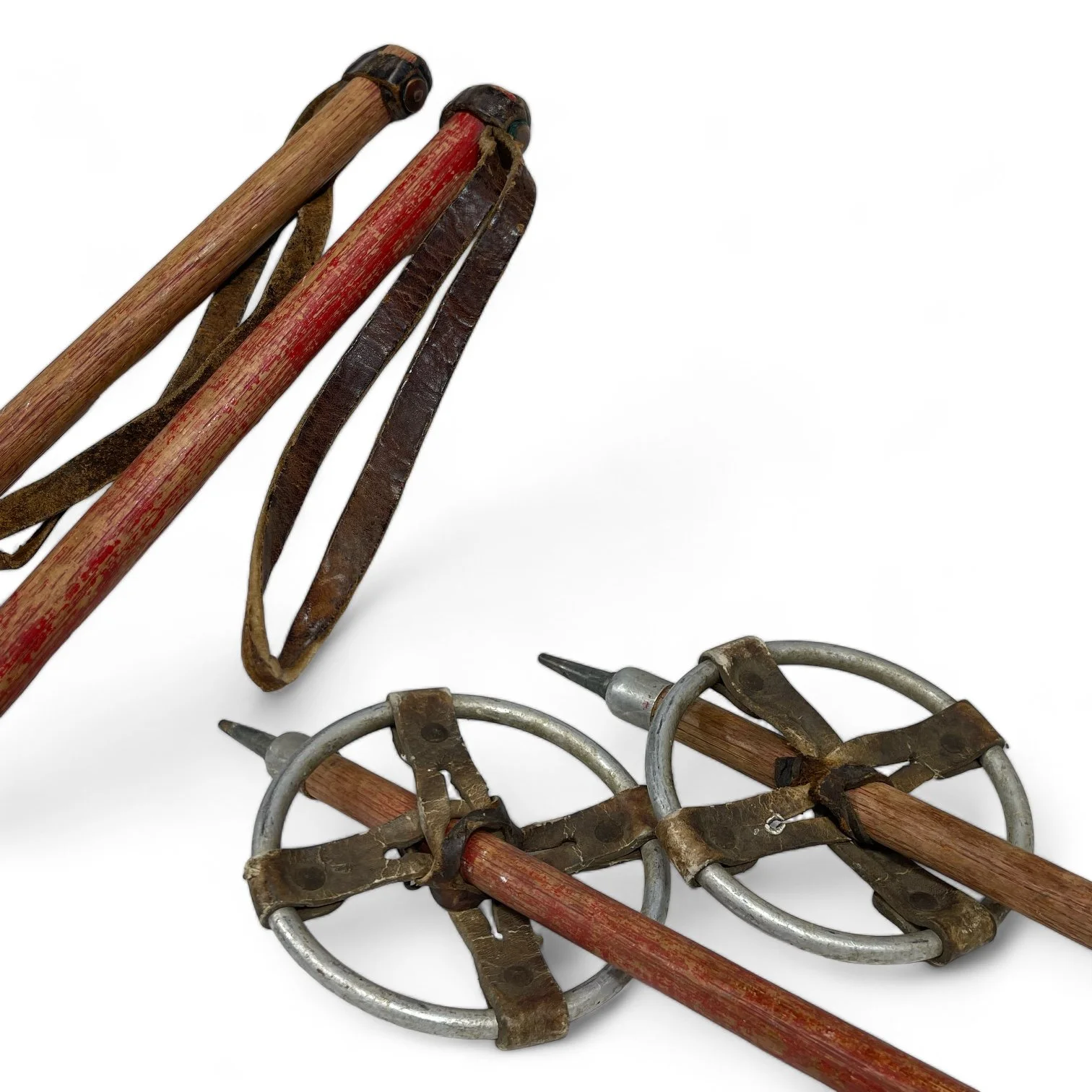 Vintage wooden snow shoes by C.A. Lund with wooden poles.