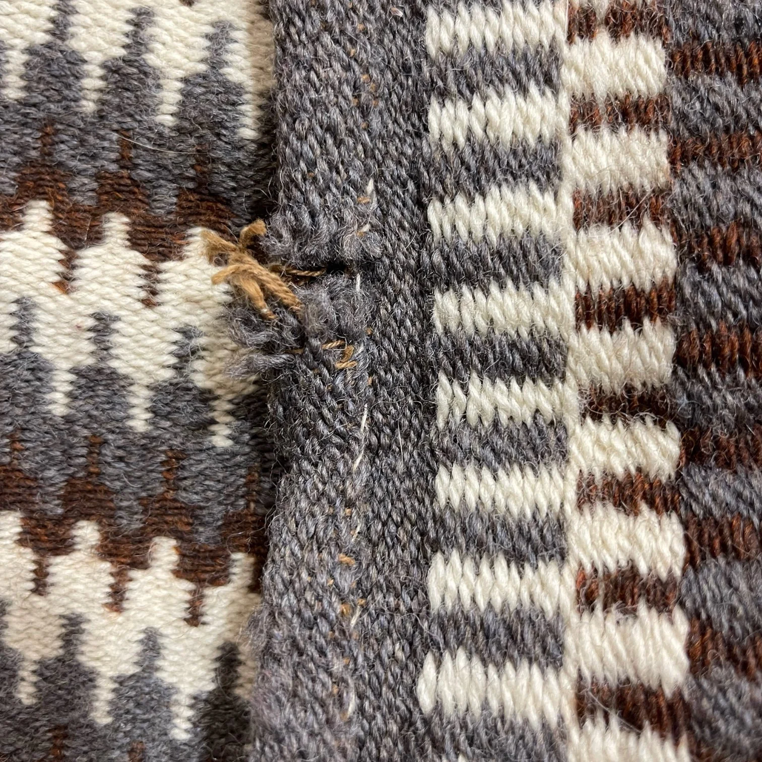 Vintage handmade wool textile throw in dark brown and grey geometric pattern 46x24.