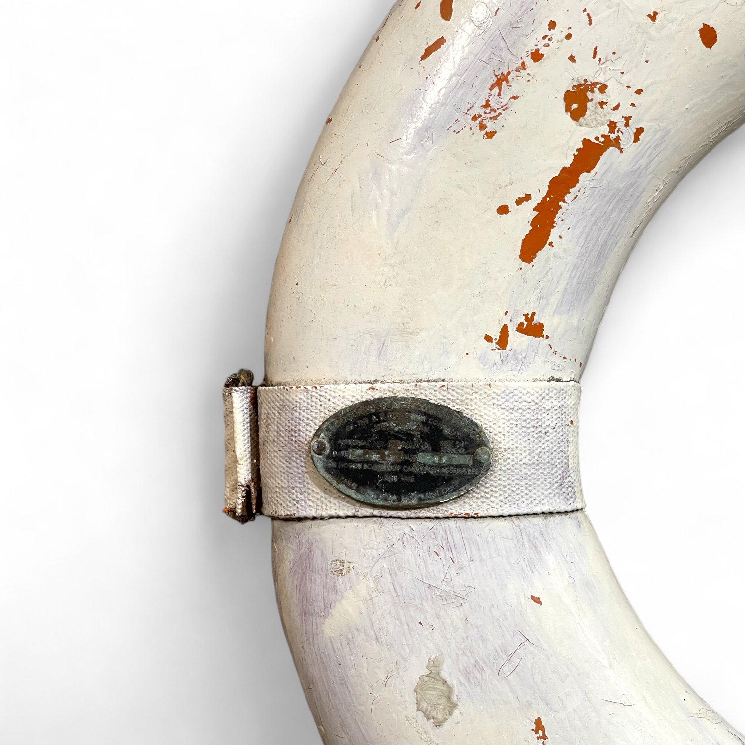 Vintage 1950s weathered, white life preserver buoy from the B.F. Goodrich Company, Sponge Products Division.