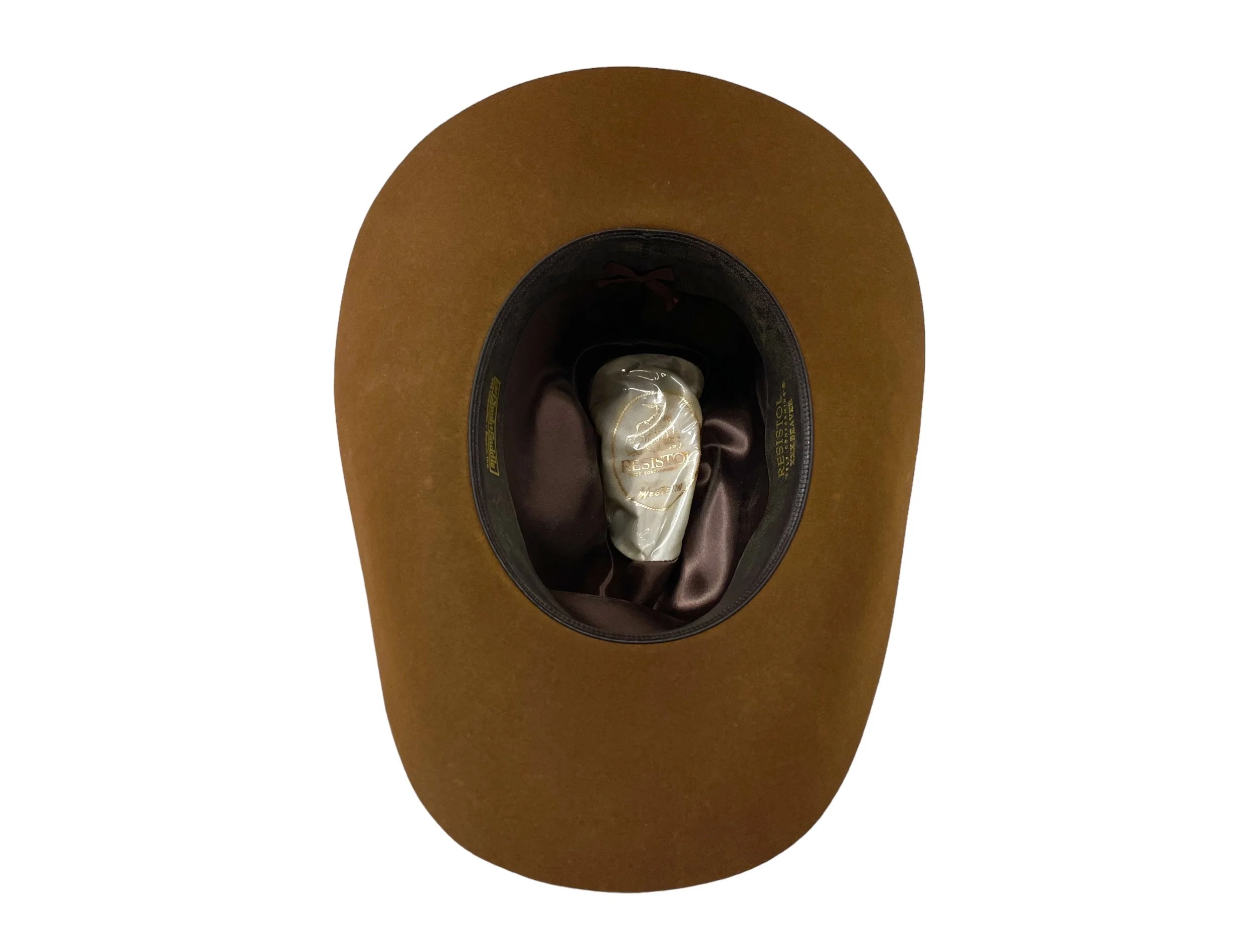 Inside view of a vintage Resistor XXX Beaver Cowboy hat with hatband with colorful feathers. Size 7 1/4 in a brown color. Made in USA.
