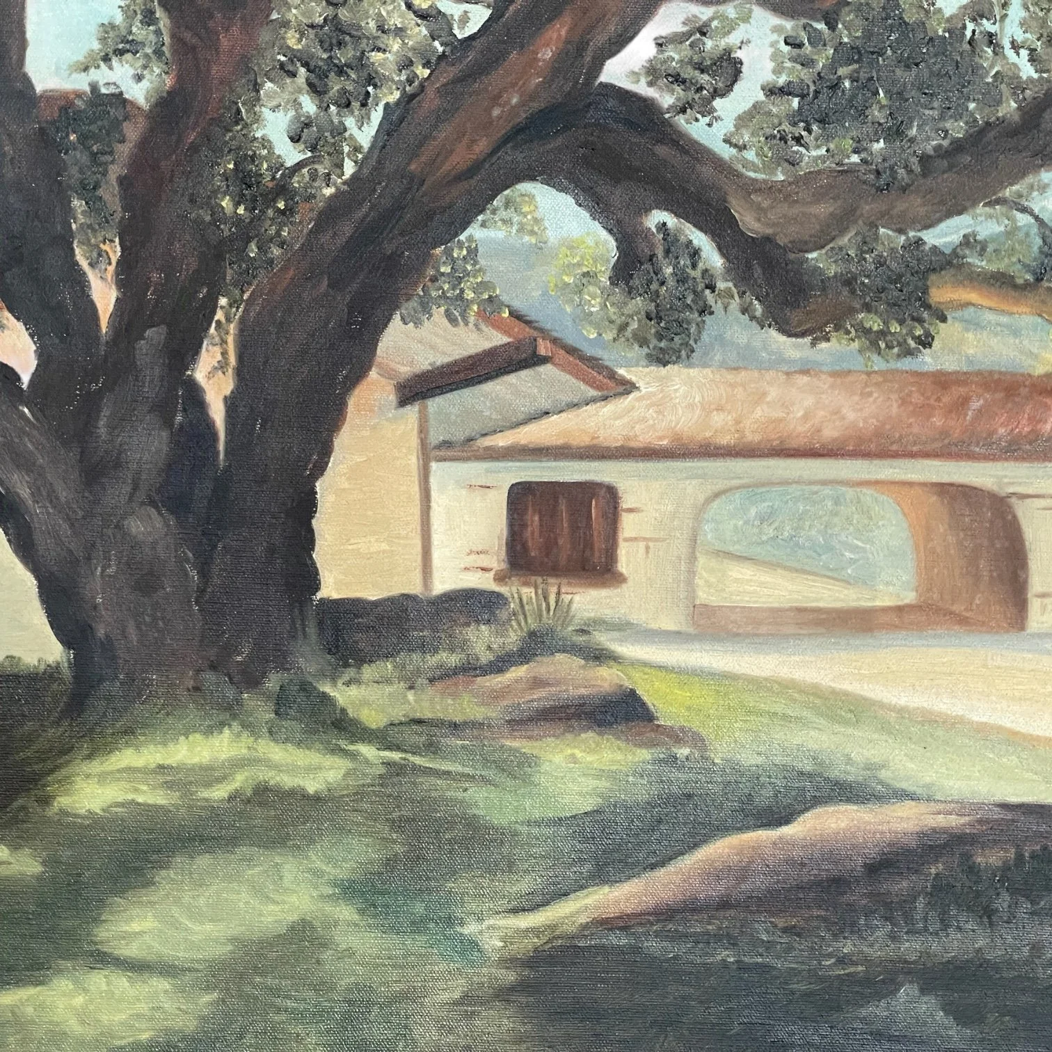 Vintage 32 x 26 inch original painting of oak tree and Spanish style home, in muted earth tone colors in a hand carved wood frame.