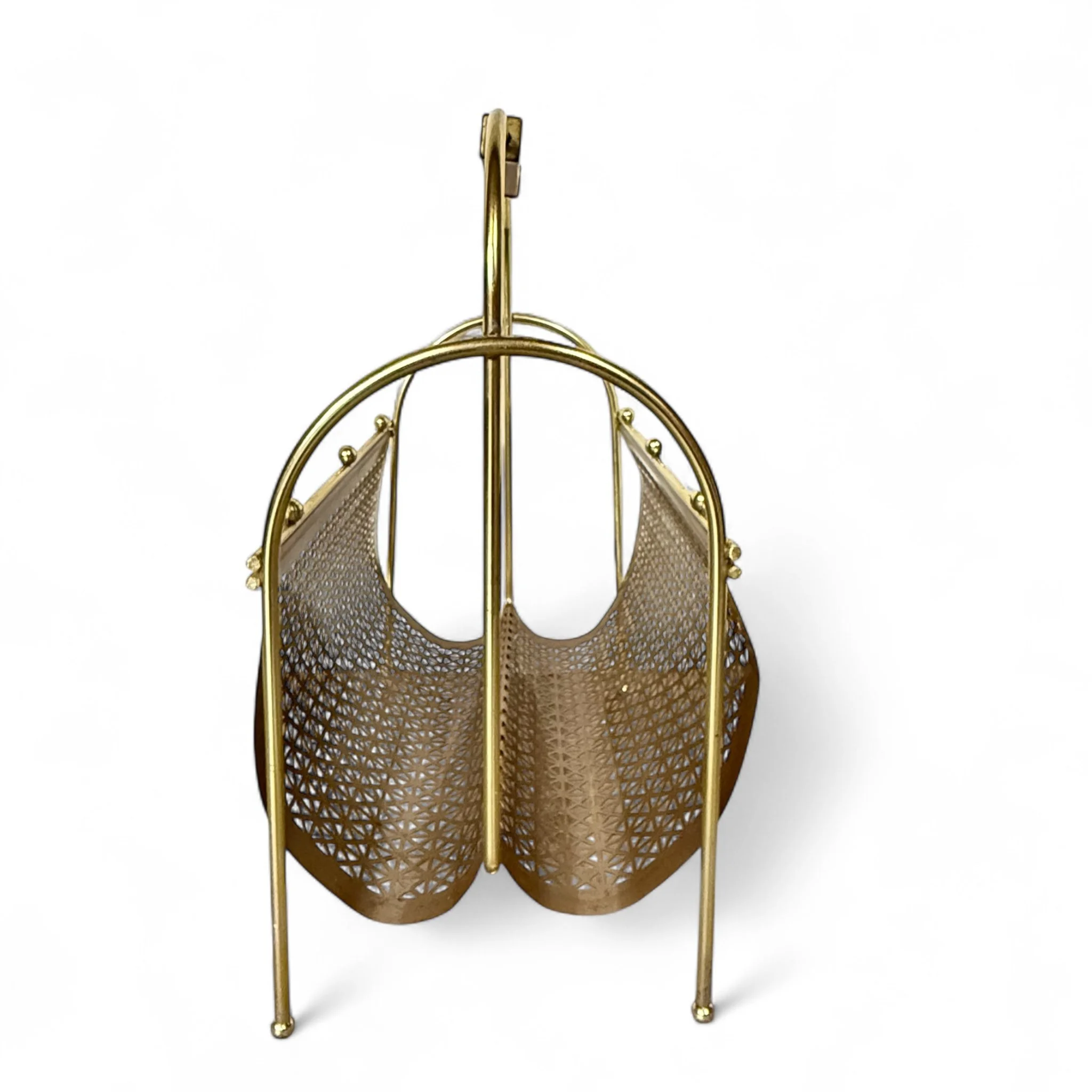 Side view of a gold vintage mid century modern magazine rack made of geometric metal pattern and a teak wood handle, ideal for decor or storage.
