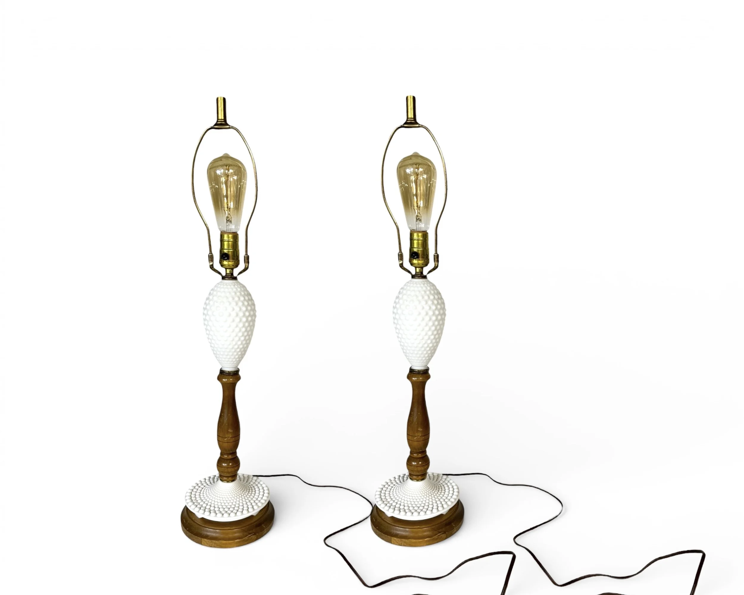 Pair of vintage white hobnail glass and wood table lamps on white background