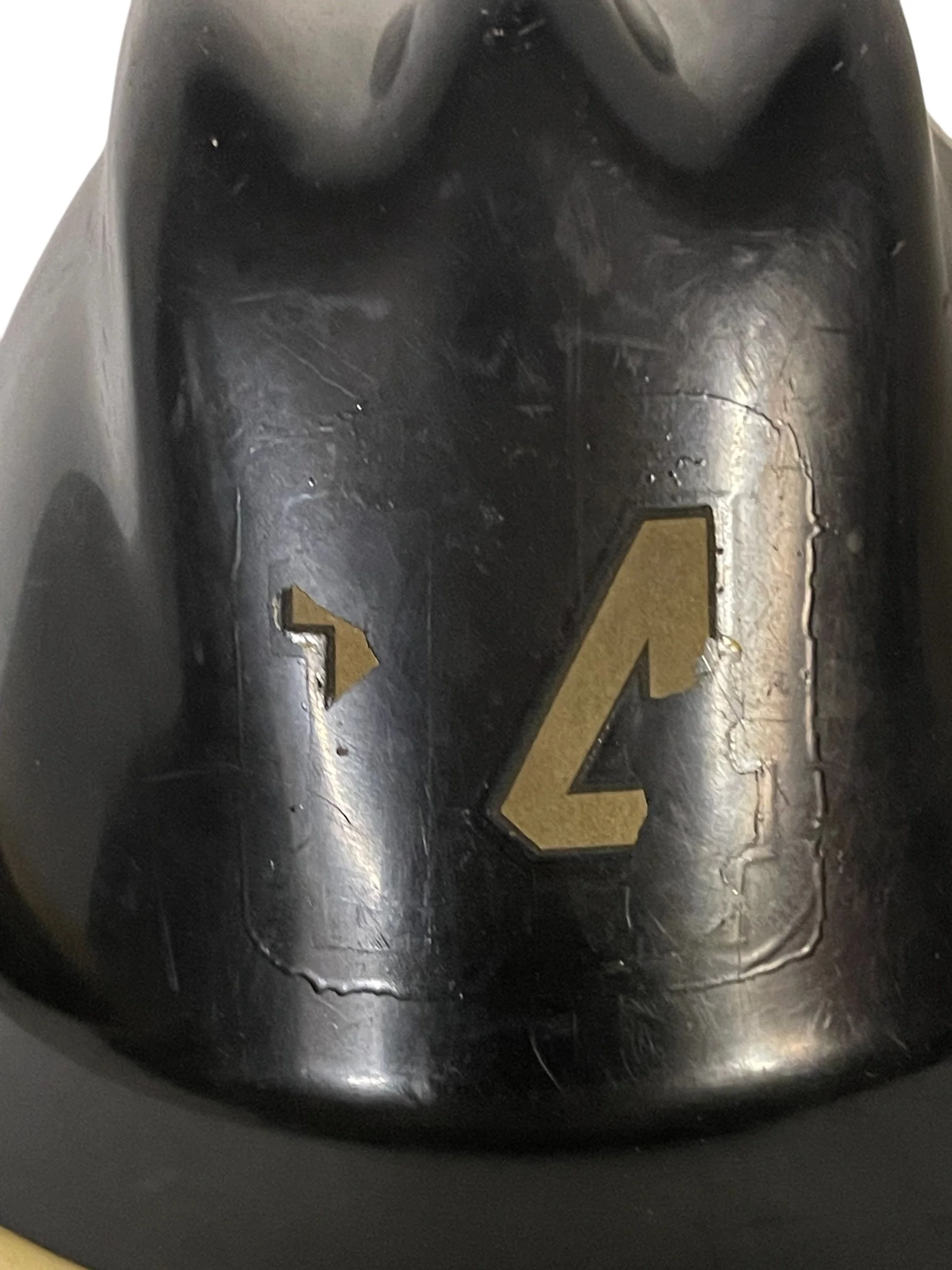 Vintage black firefighter helmet with classic design, an antique fireman collectible perfect for display, gift for fireman memorabilia, or fire department decor.