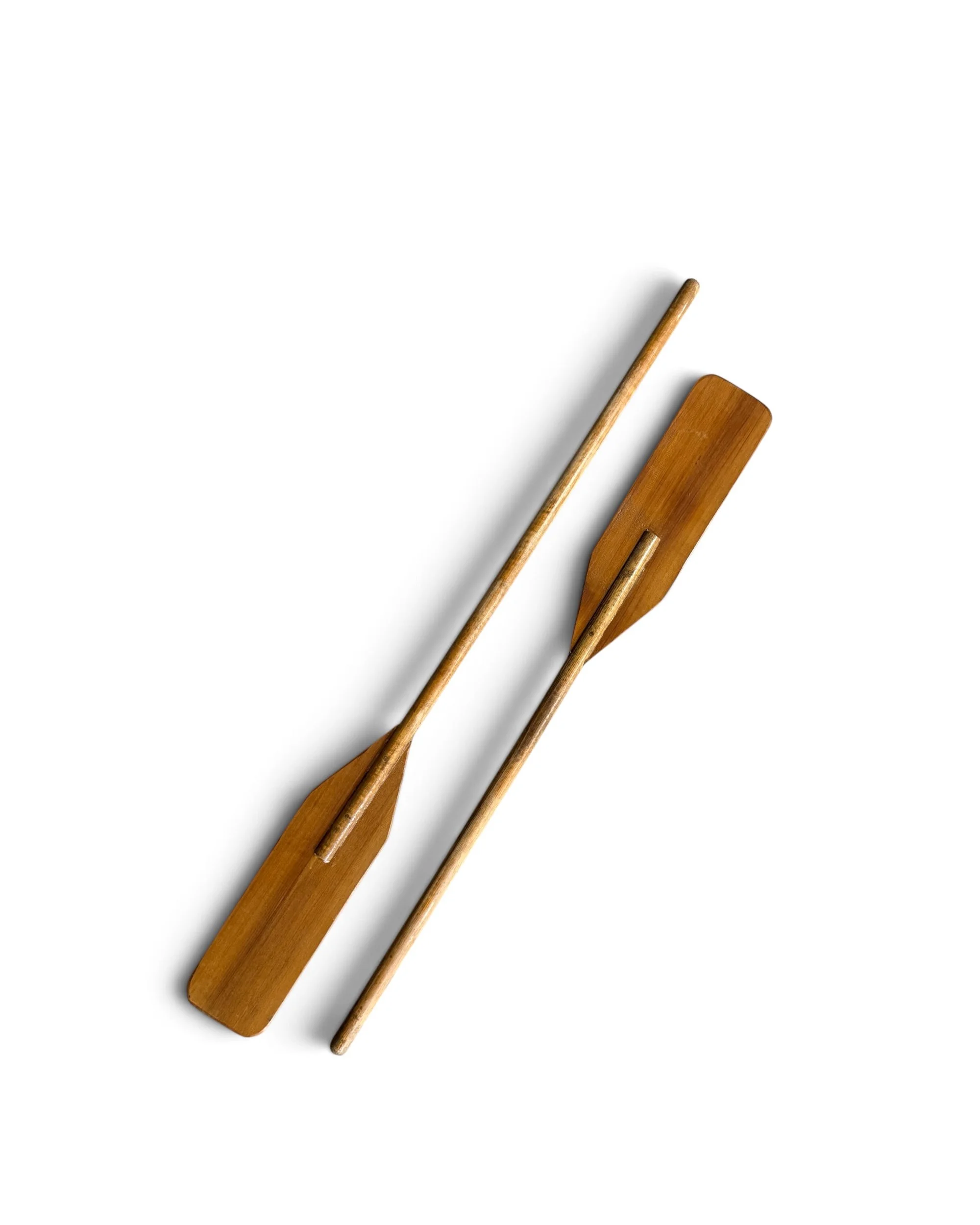 pair of vintage brown boat oar paddles for coastal decor