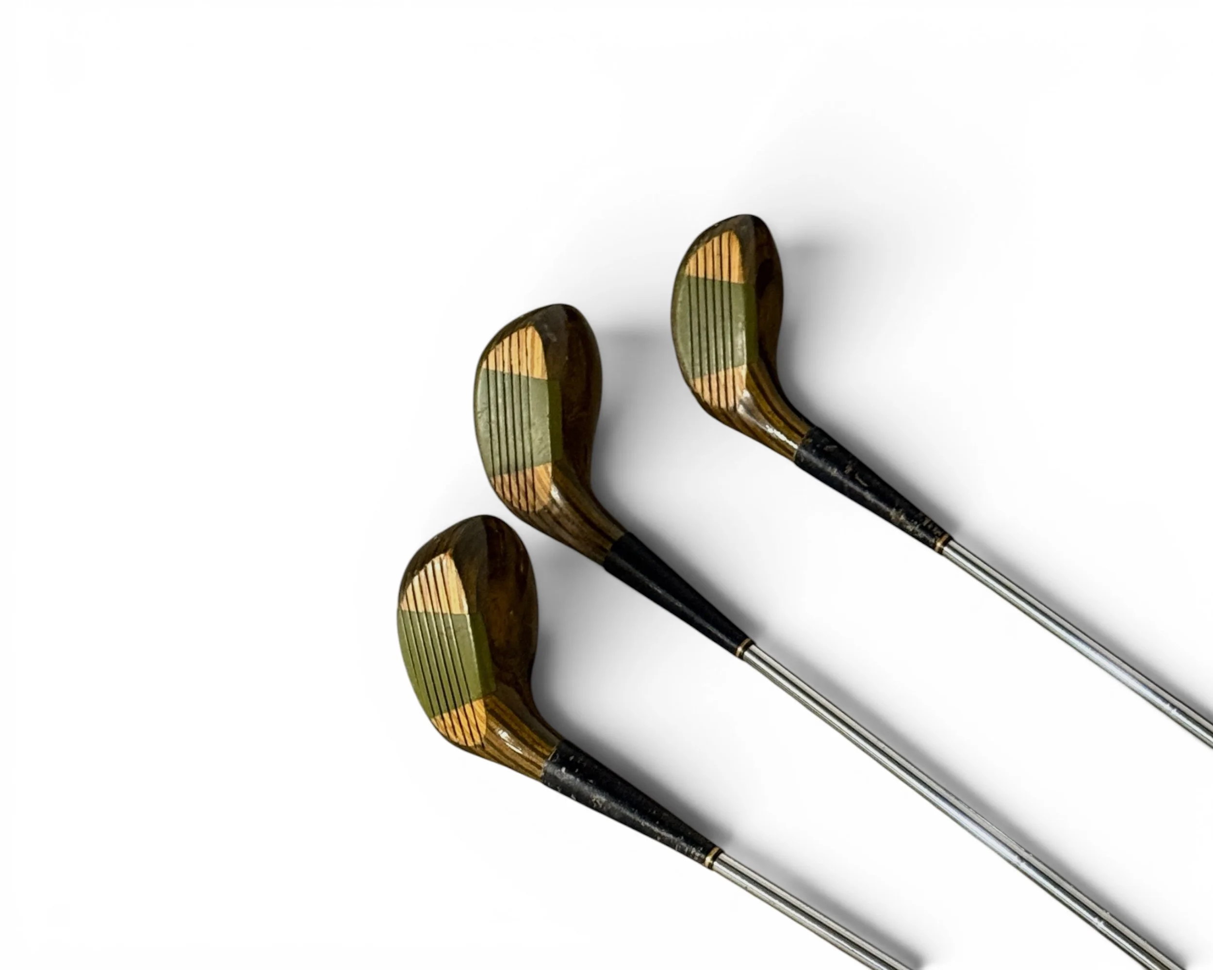 Set of three vintage Spalding ladies golf clubs with wooden heads and steel shafts