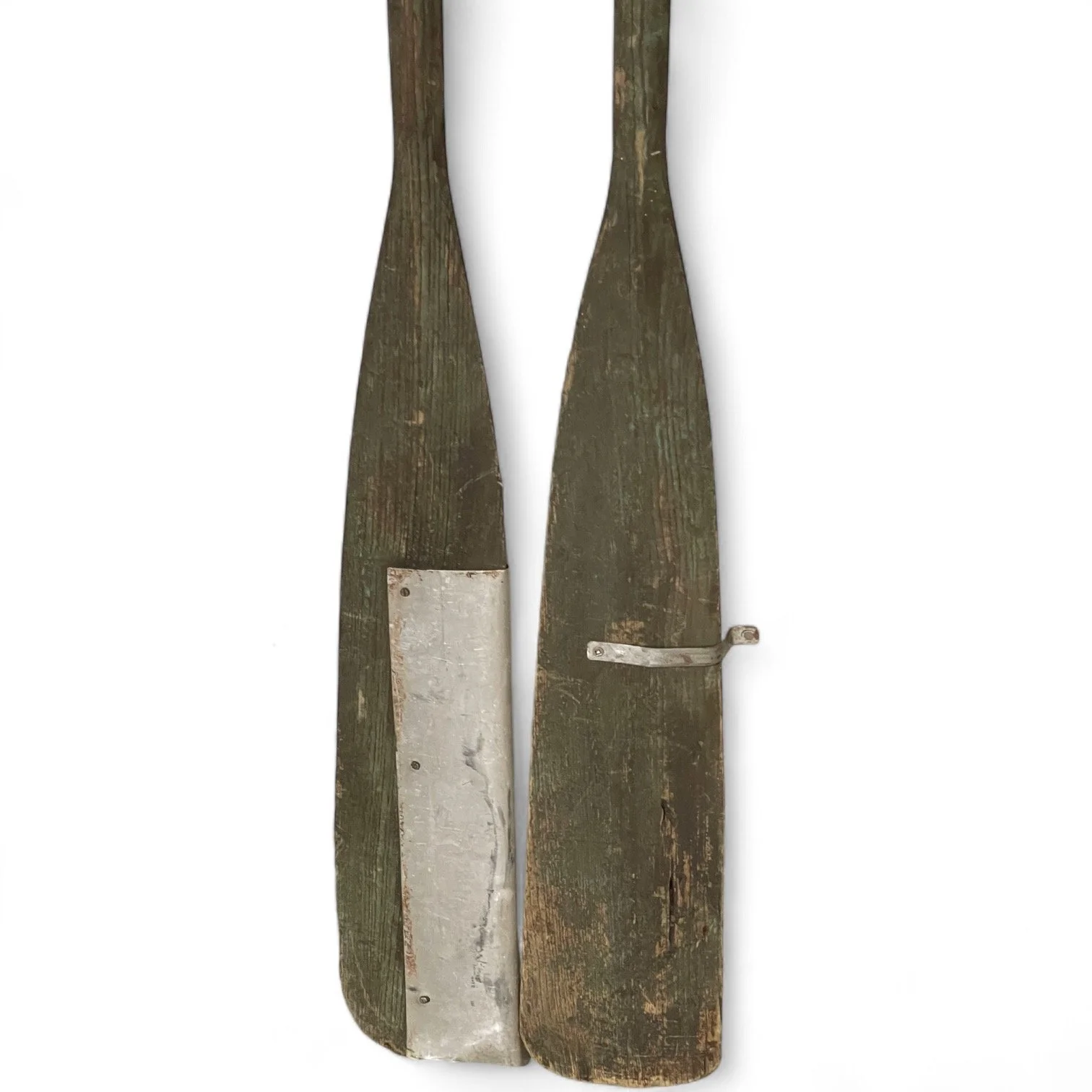 Pair of vintage wooden green boat oars with metal and oar locks.