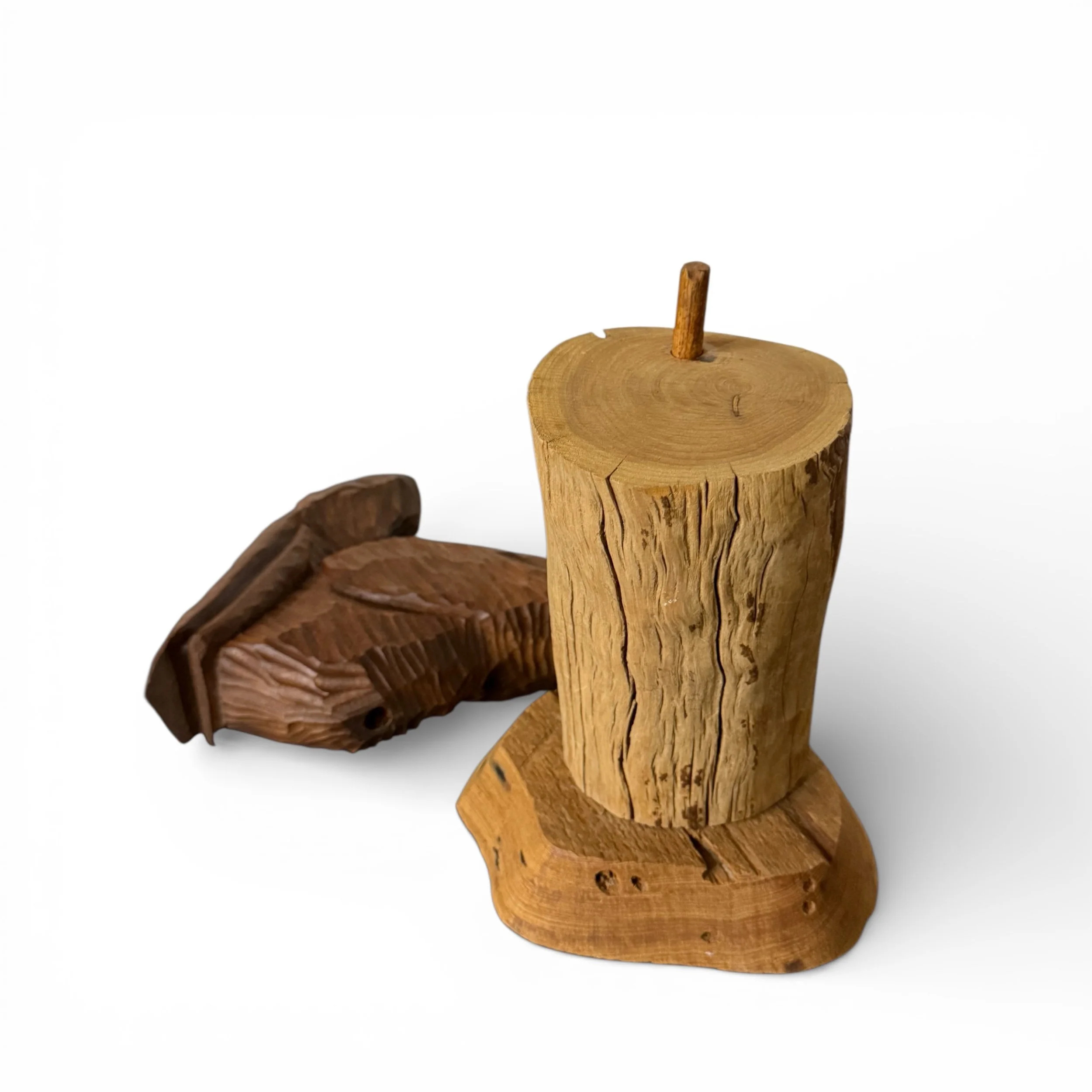 vintage hand carved wooden pelican - 2 piece set shown with pelican next to log with a wooden dowel